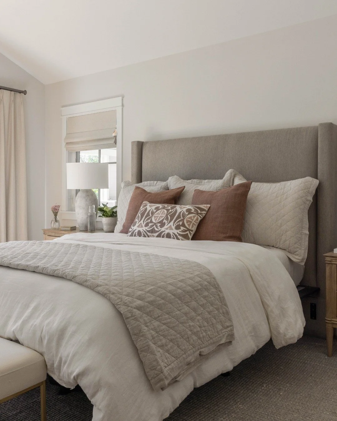 I&rsquo;m always looking for ways to make a neutral room feel interesting without adding something simply for the sake of it. In this bedroom, it came down to texture.

Linen, warm wood, quilting, woven shades, and a small dose of pattern add just en