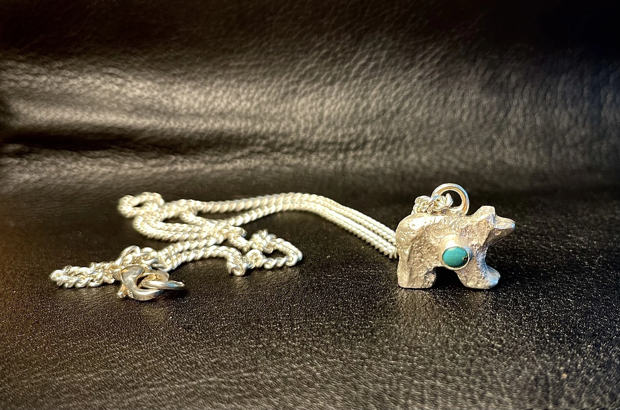 Hand cast silver bear with turquoise setting on silver chain