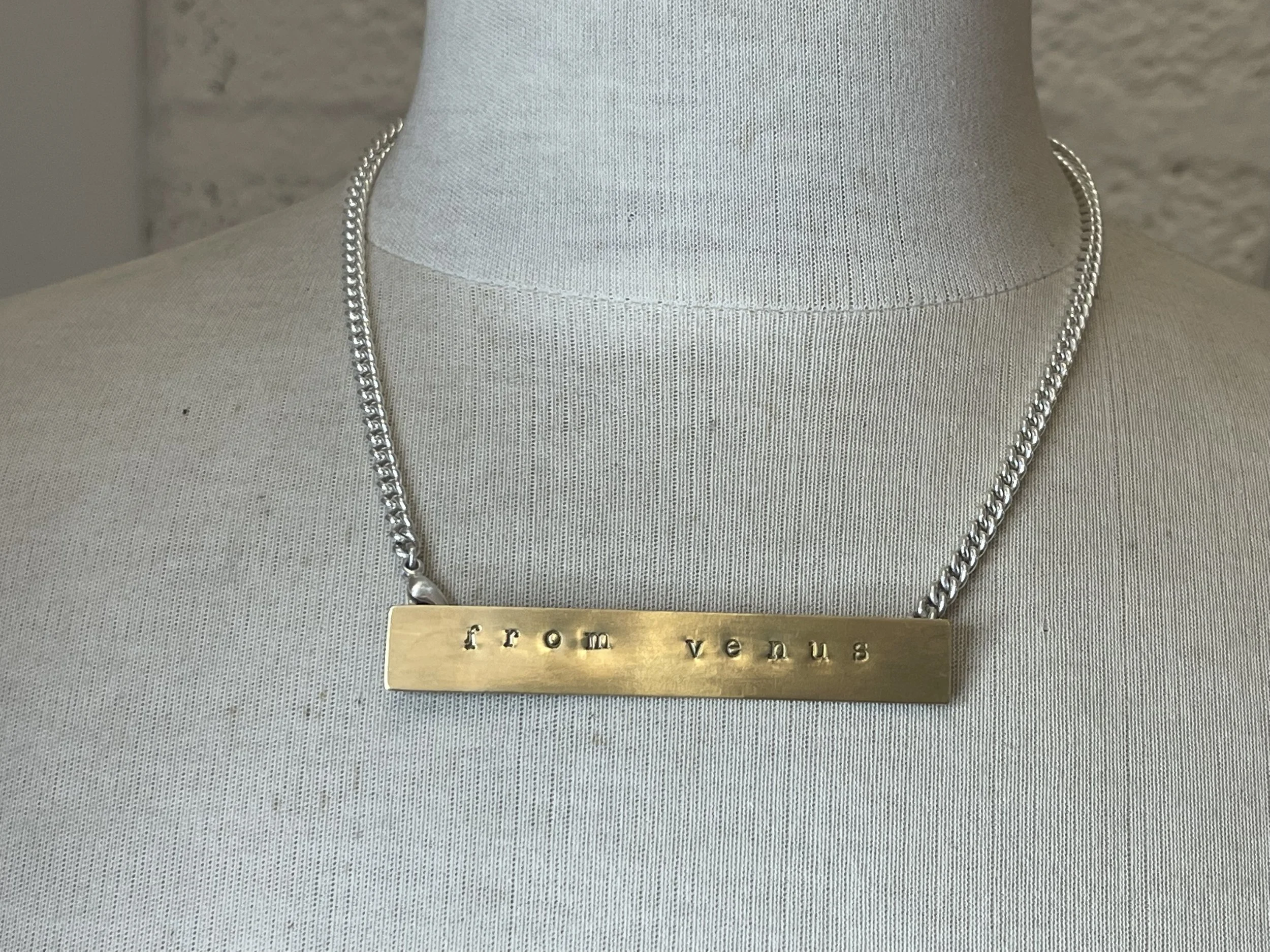 Brass tag on silver chain with bespoke message