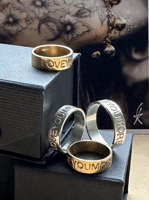A set of message rings in silver and Fairmined gold