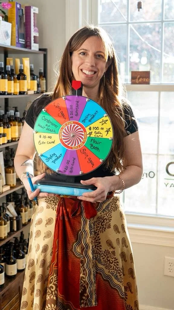 Leah Lattus with the lucky wheel at the client appreciation night 2026