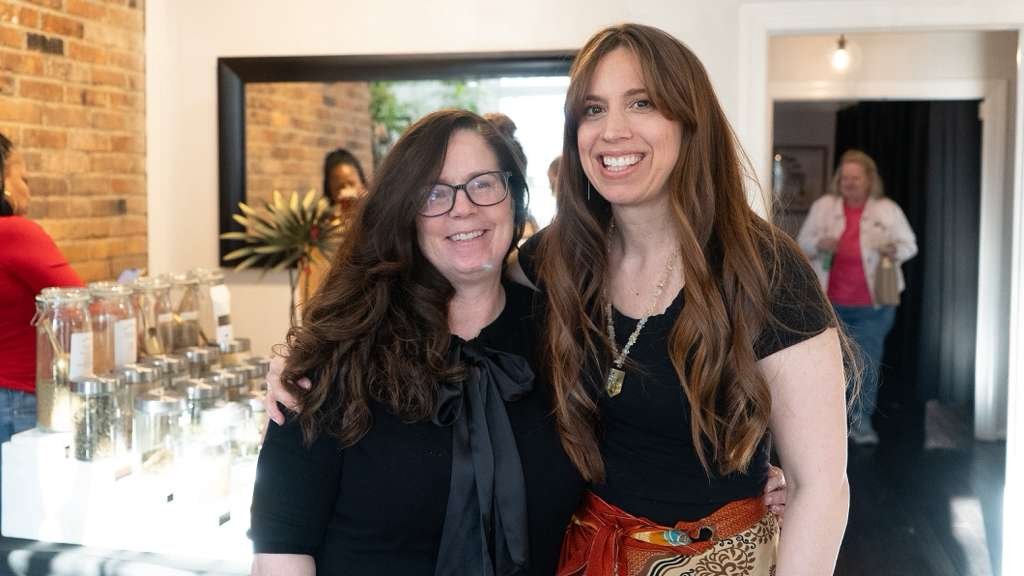 Leah Lattus owner of Holistic Hair Studio with client at client appreciation night 2026