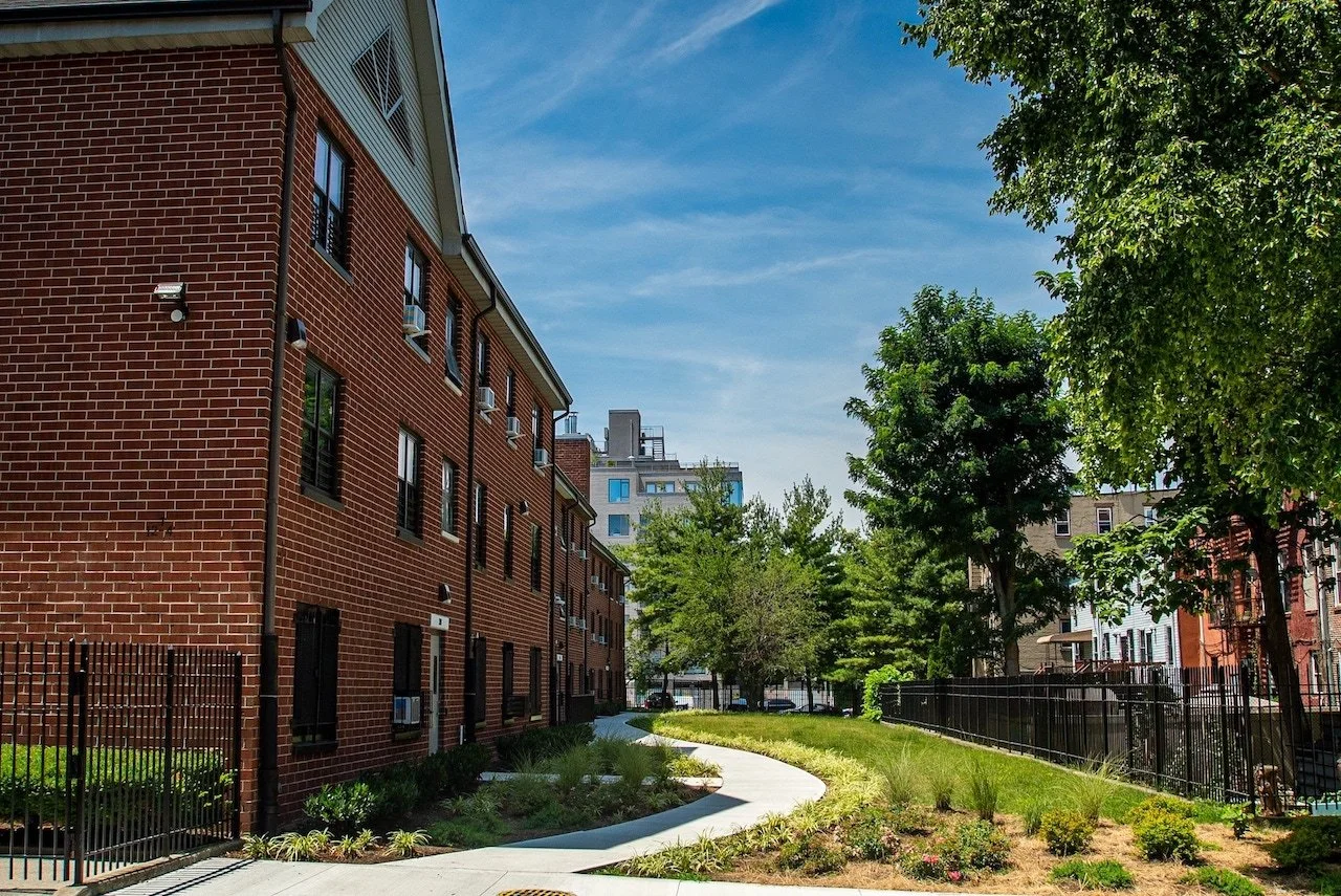 Bayview-Landscape-Architecture-NYCHA-Armstrong-MarcyGreene-9-pathway-park-courtyard-blue-sky.jpg