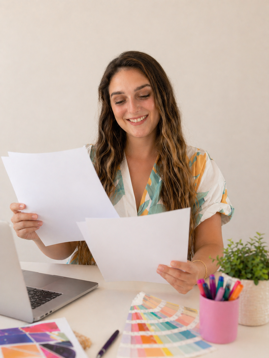 Graphic Designer in Georgia looking at printed pieces and giving feedback.