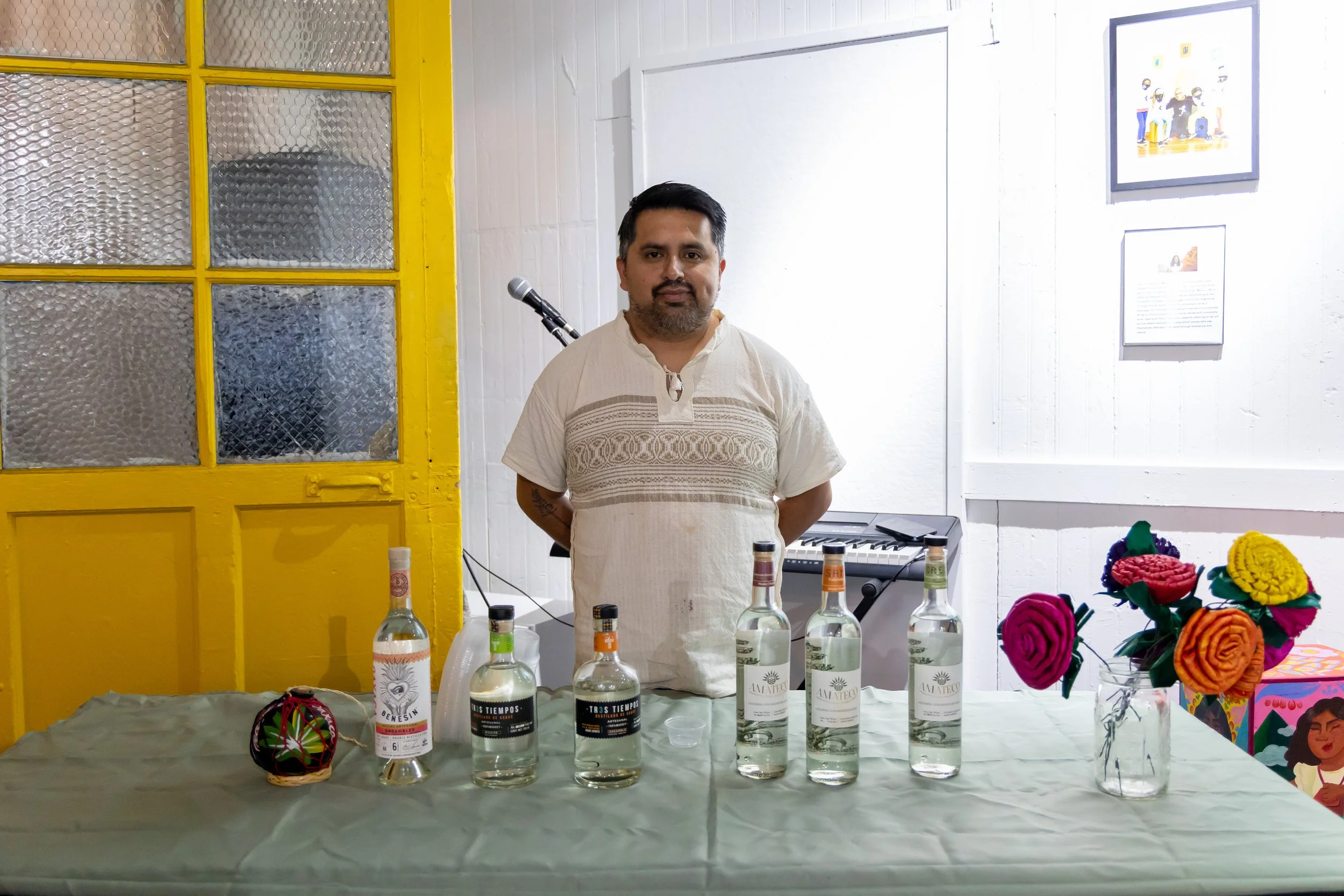 Tres Tiempos representative standing by his table during Gala-Guetza.