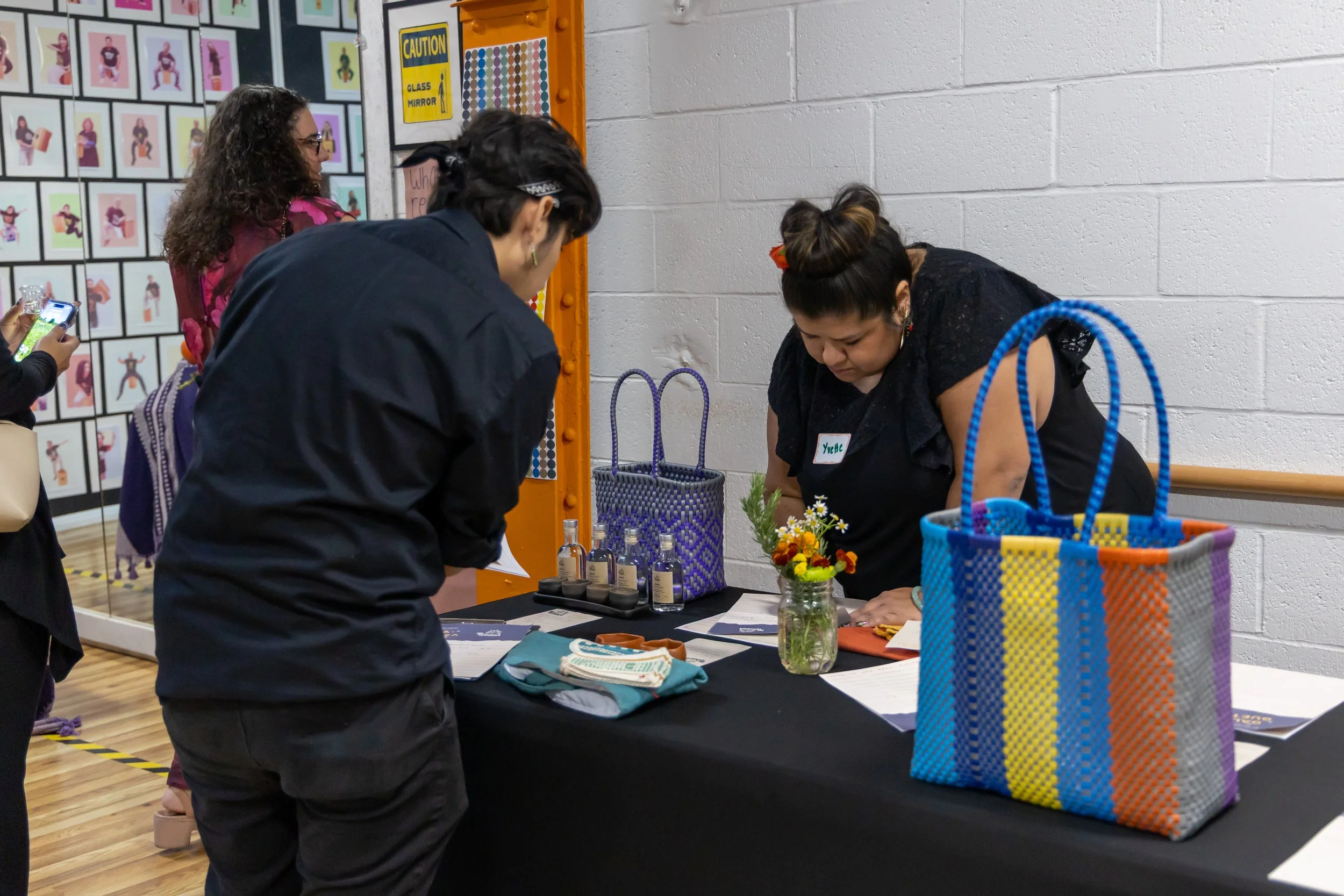 Volunteers by the silent auction table.