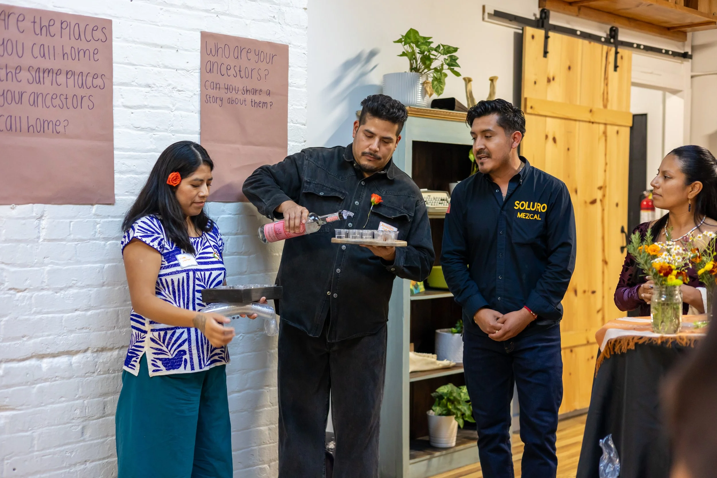 Padrino pouring Soluro mezcal. 