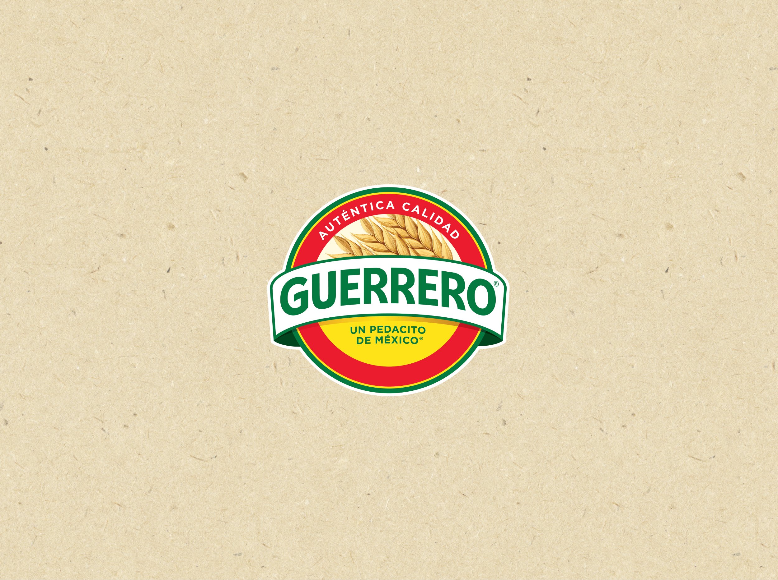 Close-up of a Guerrero logo on beige textured background, featuring a wheat graphic and red, green, and yellow colors with Spanish text.