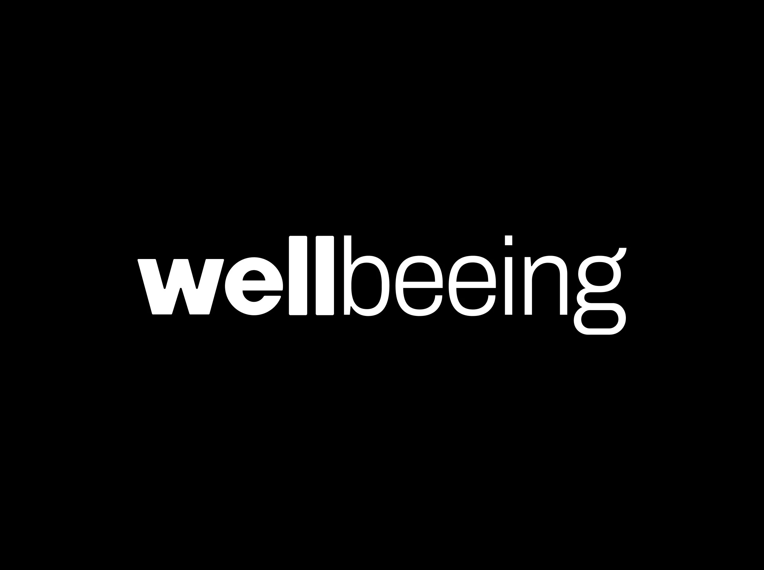 Black background with the word "wellbeing" written in white lowercase letters.