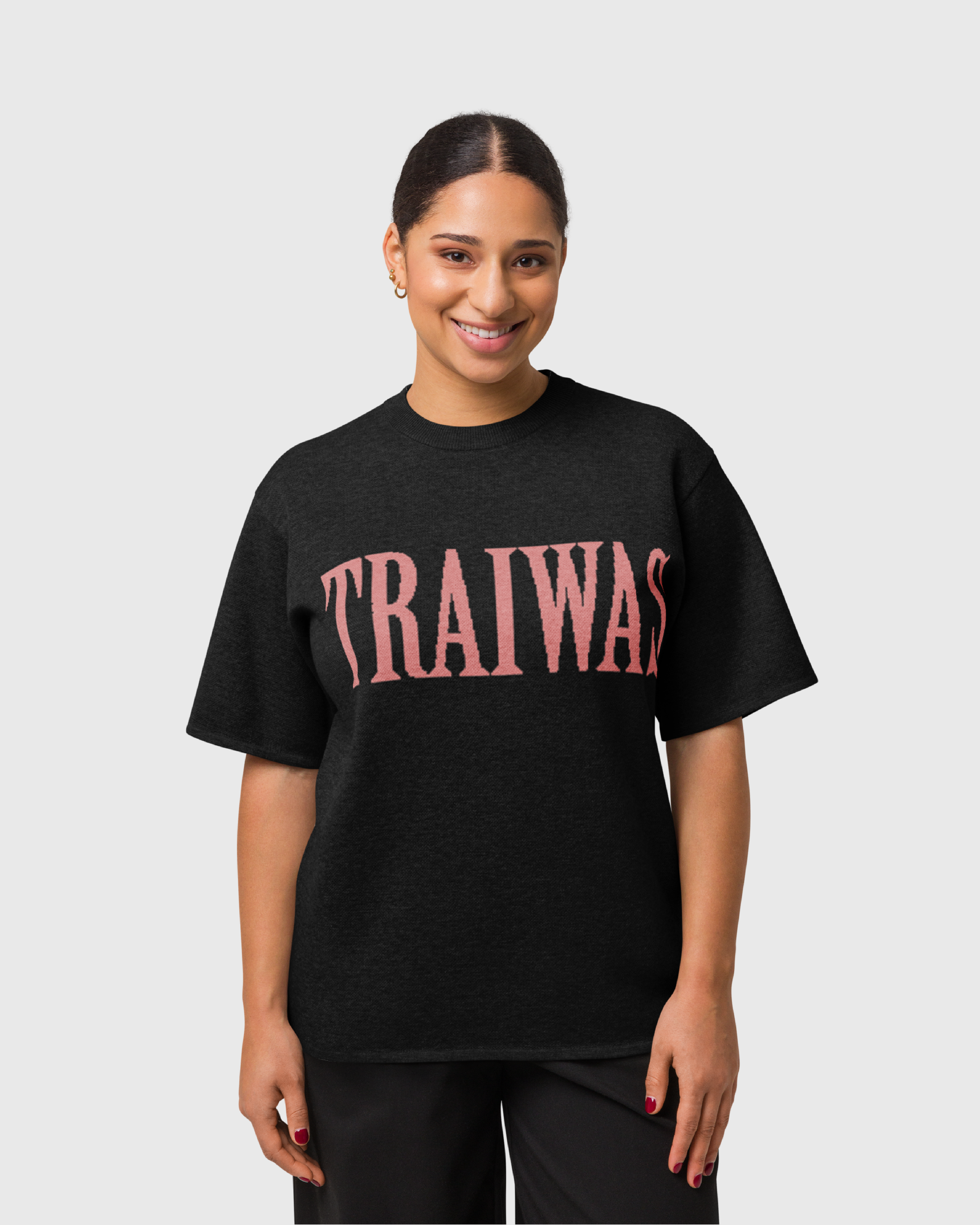 traiwas-product-knitted-t-shirt-coral-traiwas-logo-on-black-female-model.png