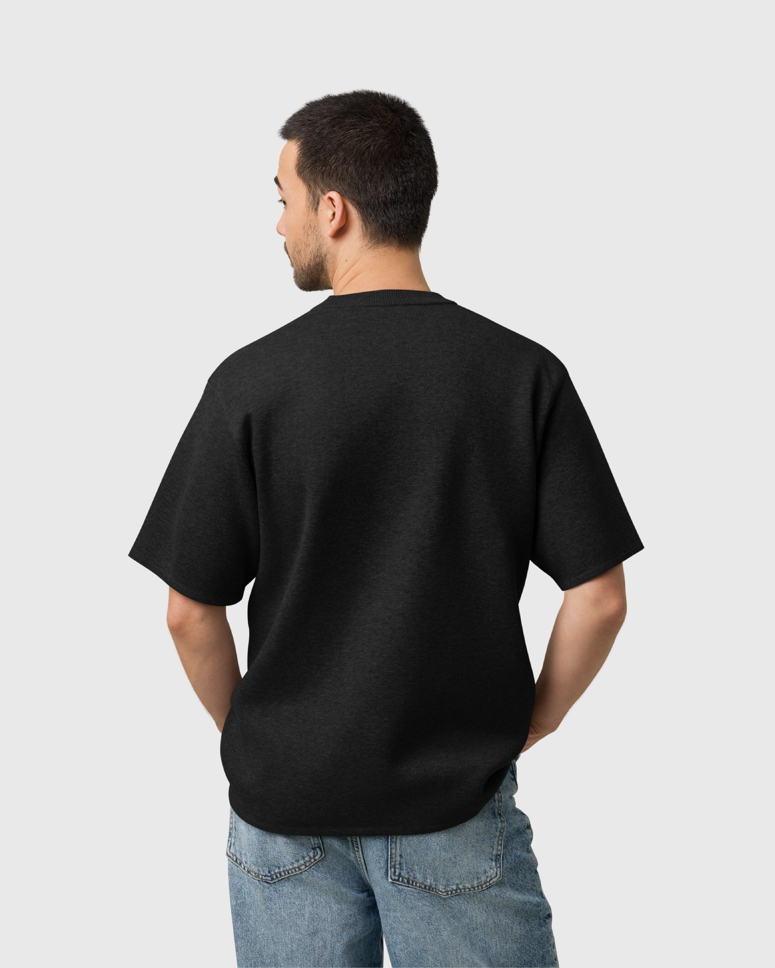 traiwas-product-knitted-t-shirt-coral-traiwas-logo-on-black-men-model-back.png