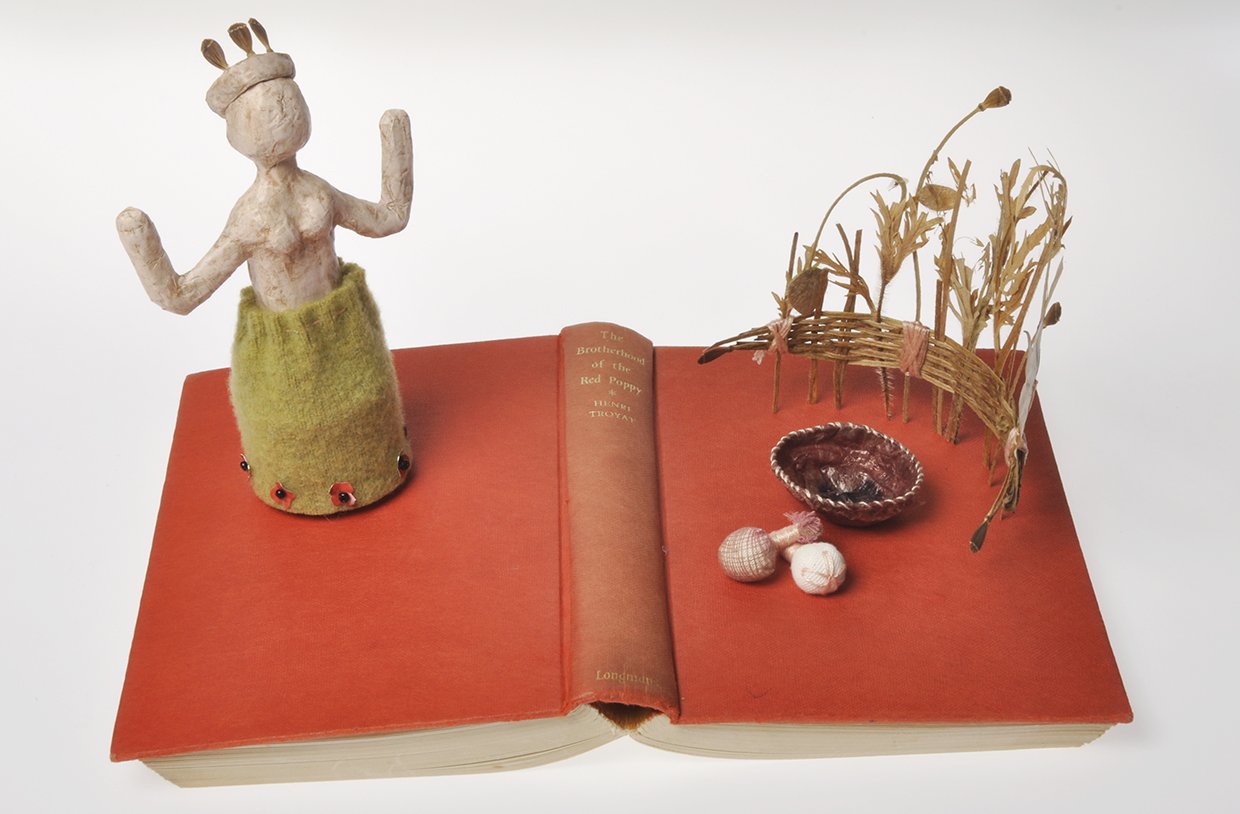 'The Poppy Goddess' book sculpture, dried poppies, paper, recycled aluminium, wire, felted wool, textiles and thread.