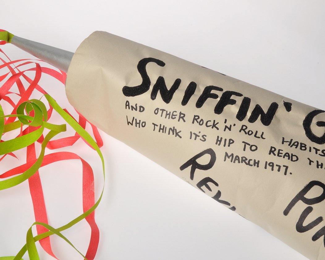 Homage to the 1970's punk zine 'Sniffin Glue', supersize paper glue tube, paper, card, acrylic paint and stitch. 80cm x 25cm x 20cm.
