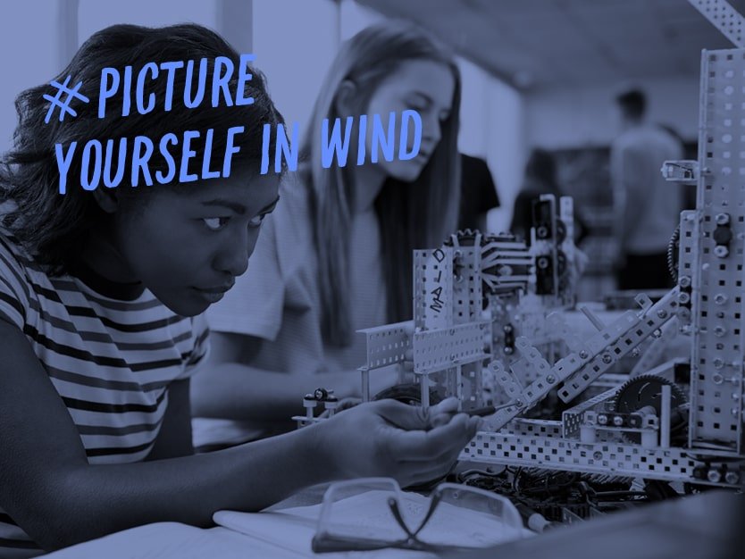 Two engineering students designing and building a project
