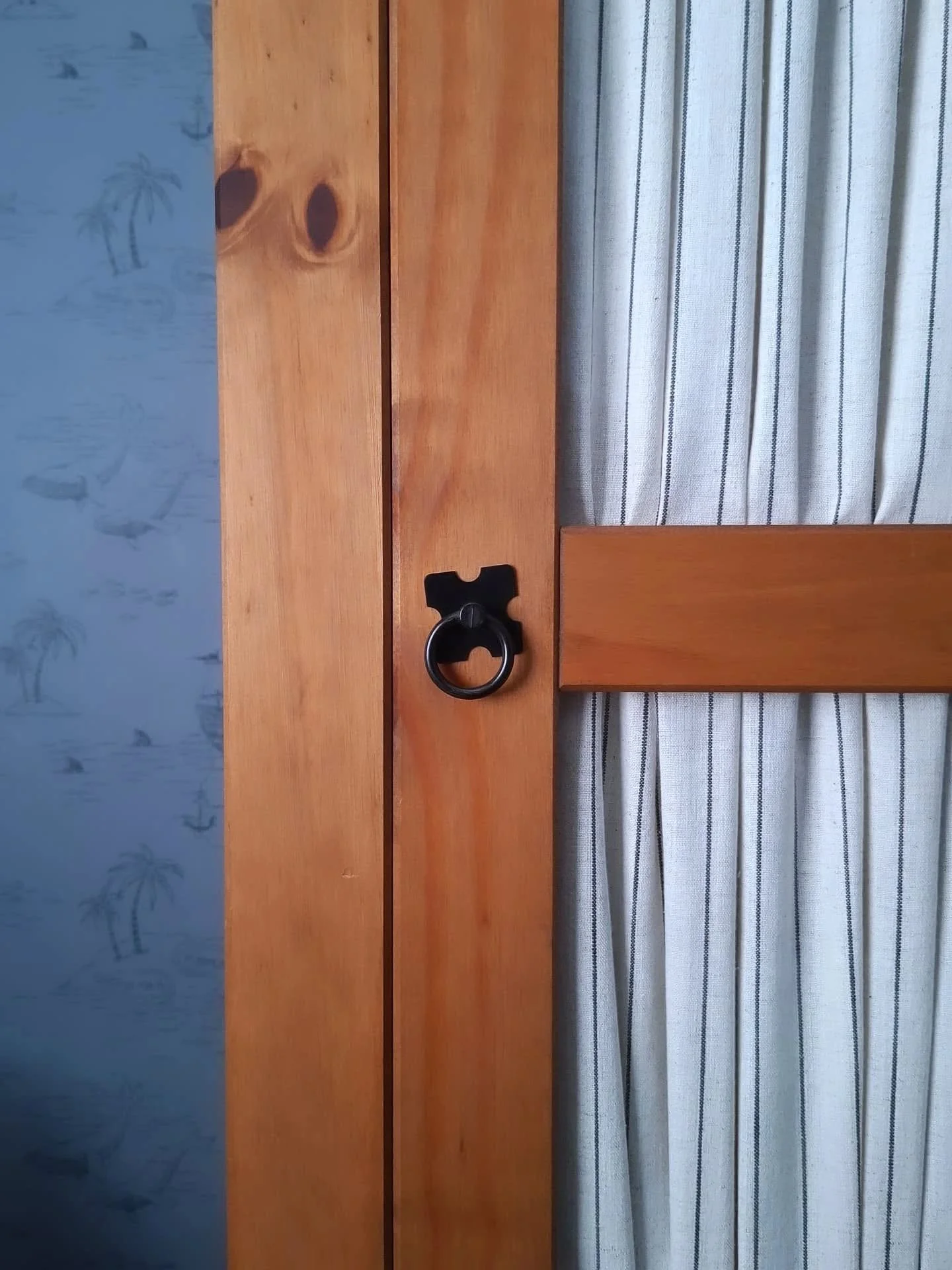 Because of the small size of this bedroom, multiple storage solutions were not an option. I had to work with the height of the room to find the right piece that would hide all the little clothes, cot sheets, towels and even toys. This cabinet was a l
