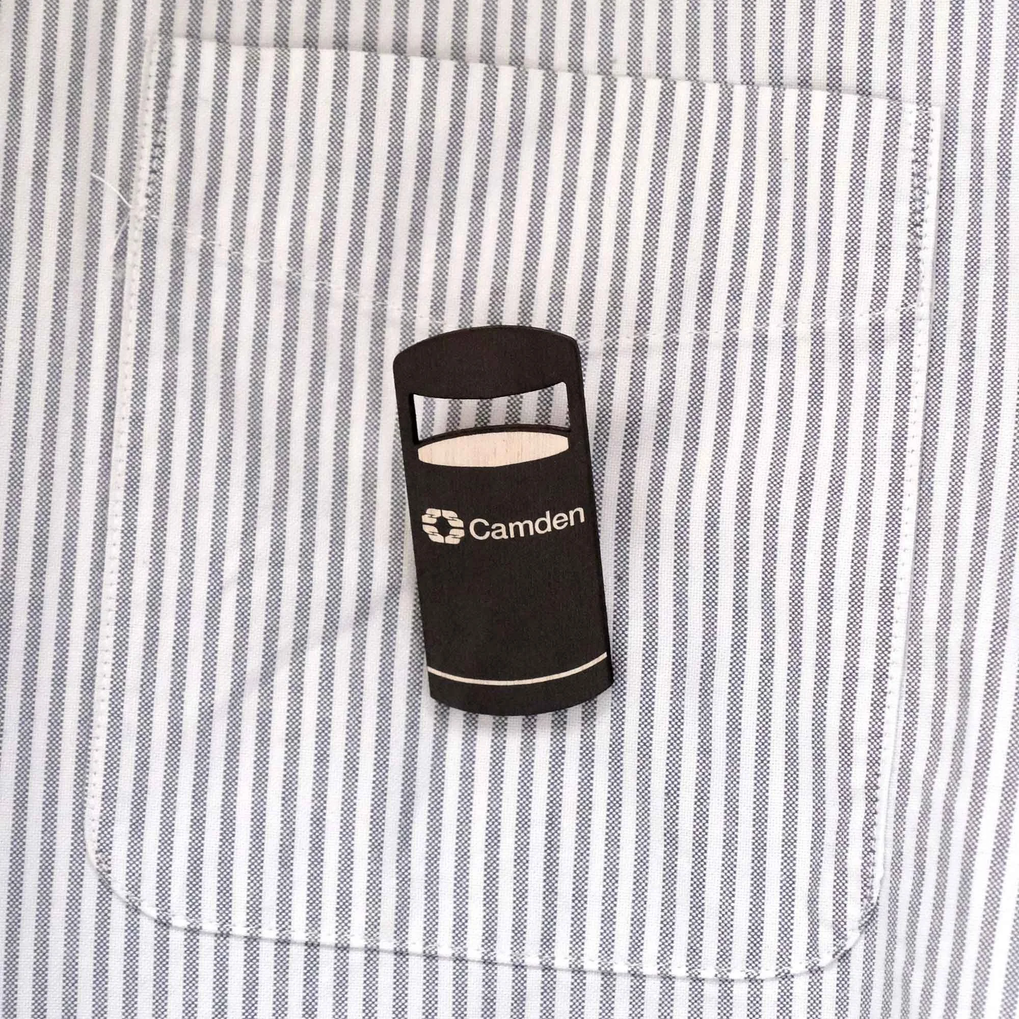 Camden bin badge on a stripy shirt pocket