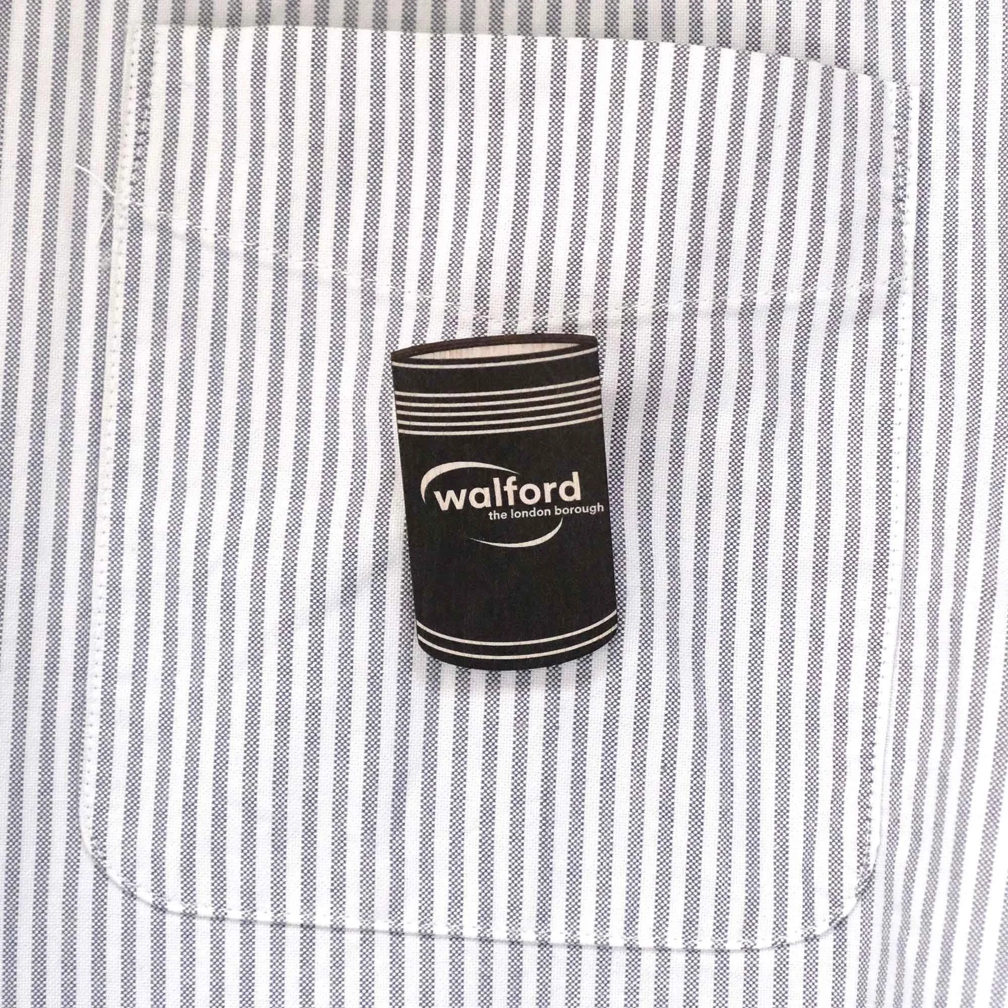 Walford bin badge on stripy shirt pocket
