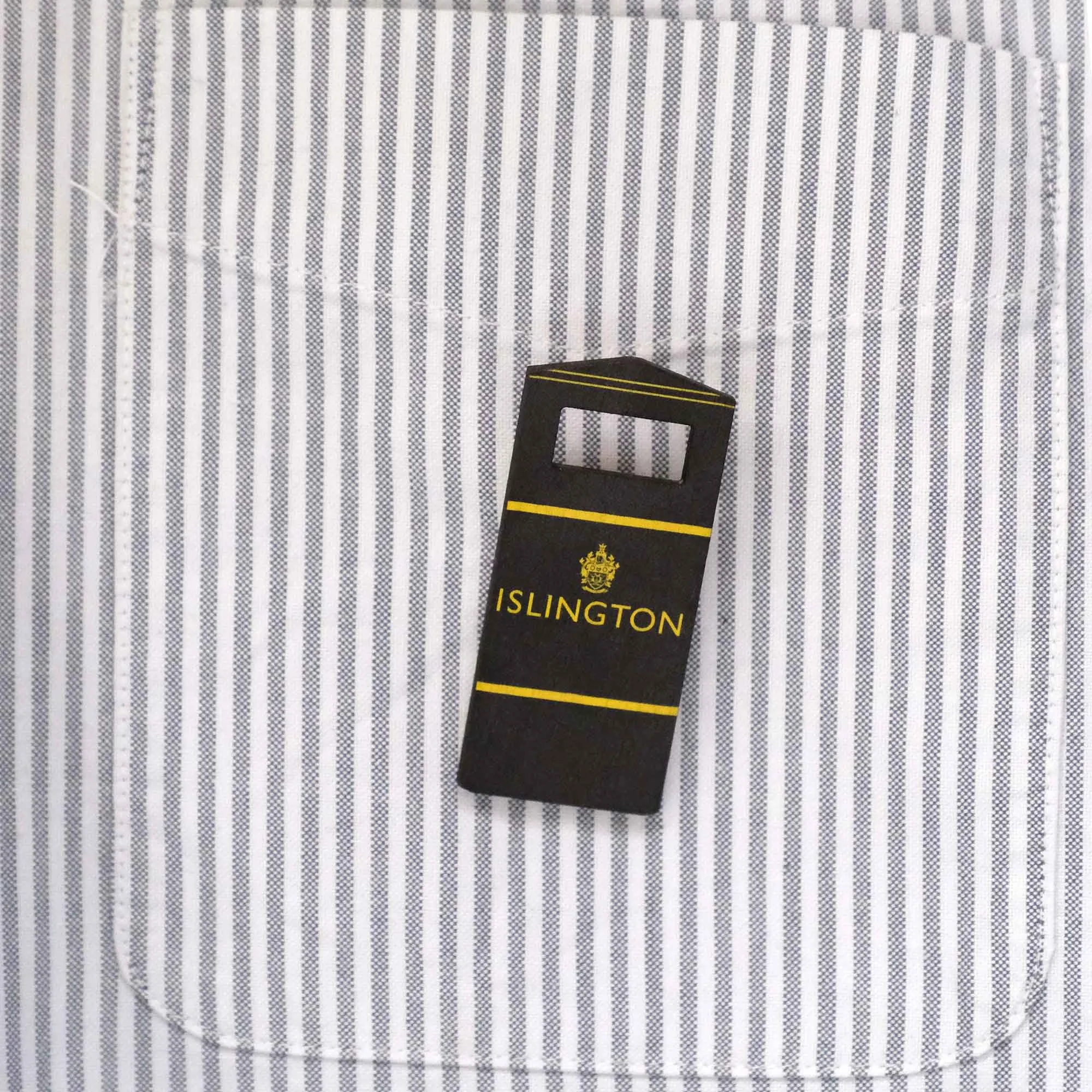 Islington bin badge on a stripy shirt pocket