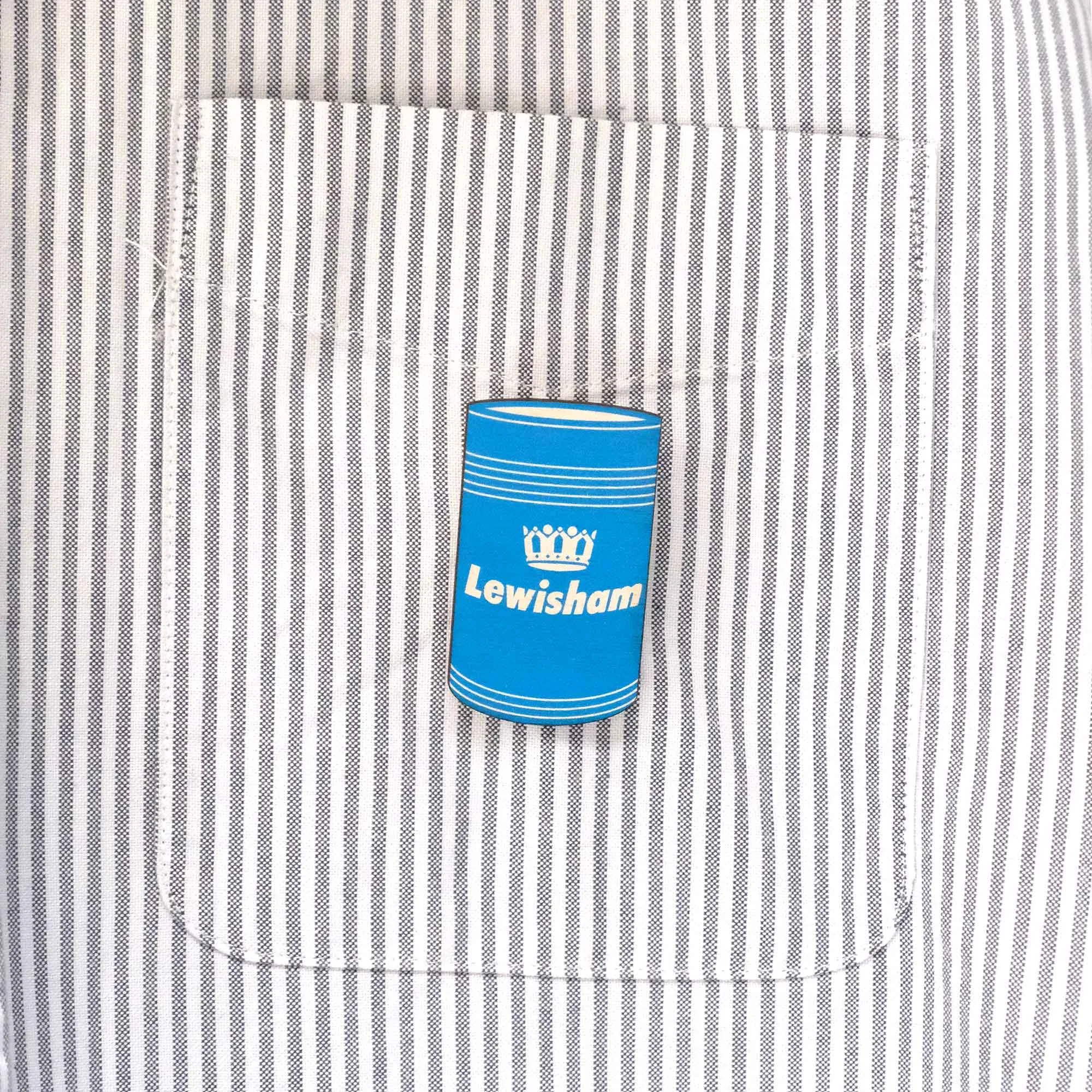 Lewisham bin badge on stripy shirt pocket