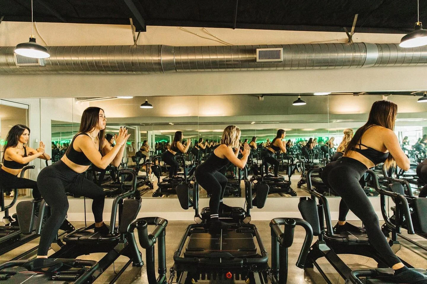 Trim Fitness Studio Lagree Fitness + VersaClimber Classes in Orange