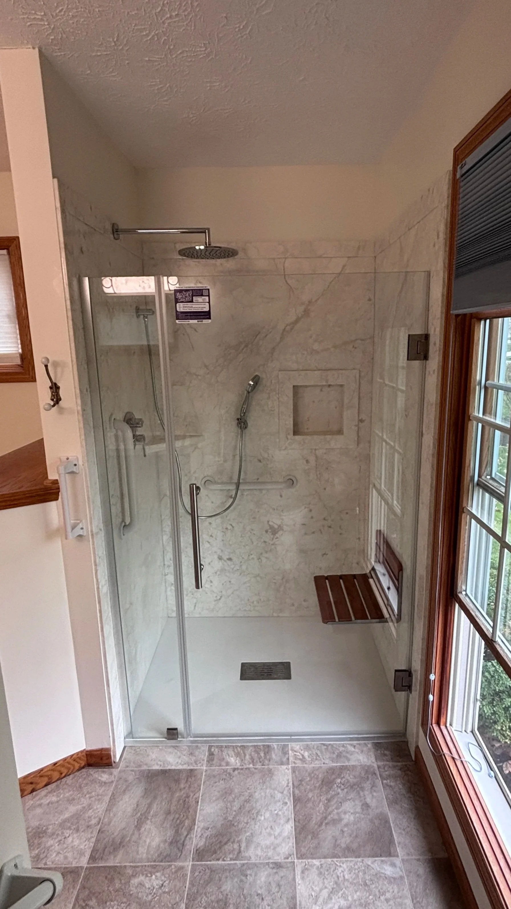 handyman bathroom remodel curbless shower swinging shower door new flooring vanity top painting wall mounted shower seat hand sprayer grab bars