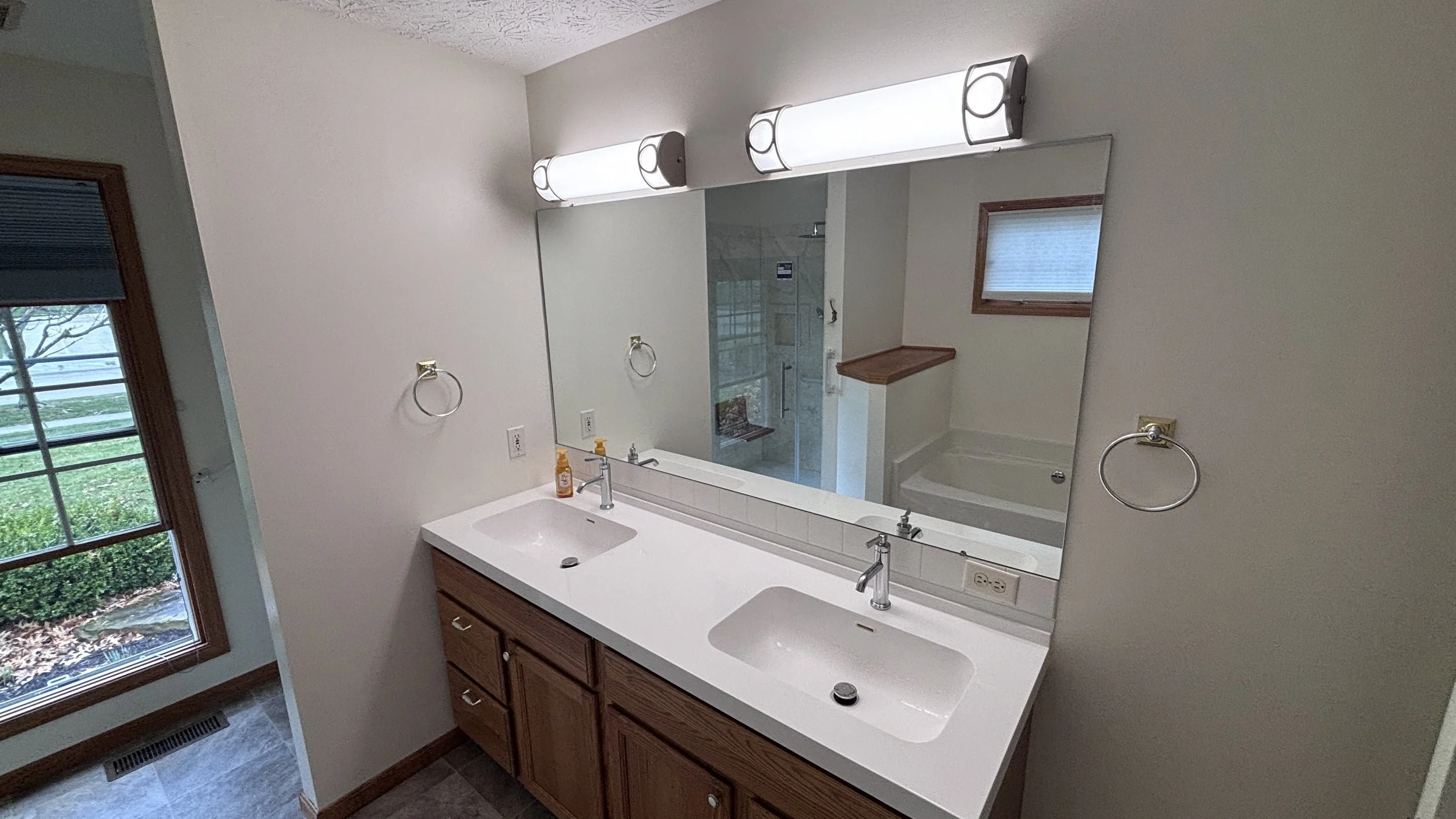 handyman bathroom remodel curbless shower swinging shower door new flooring vanity top painting wall mounted shower seat hand sprayer grab bars