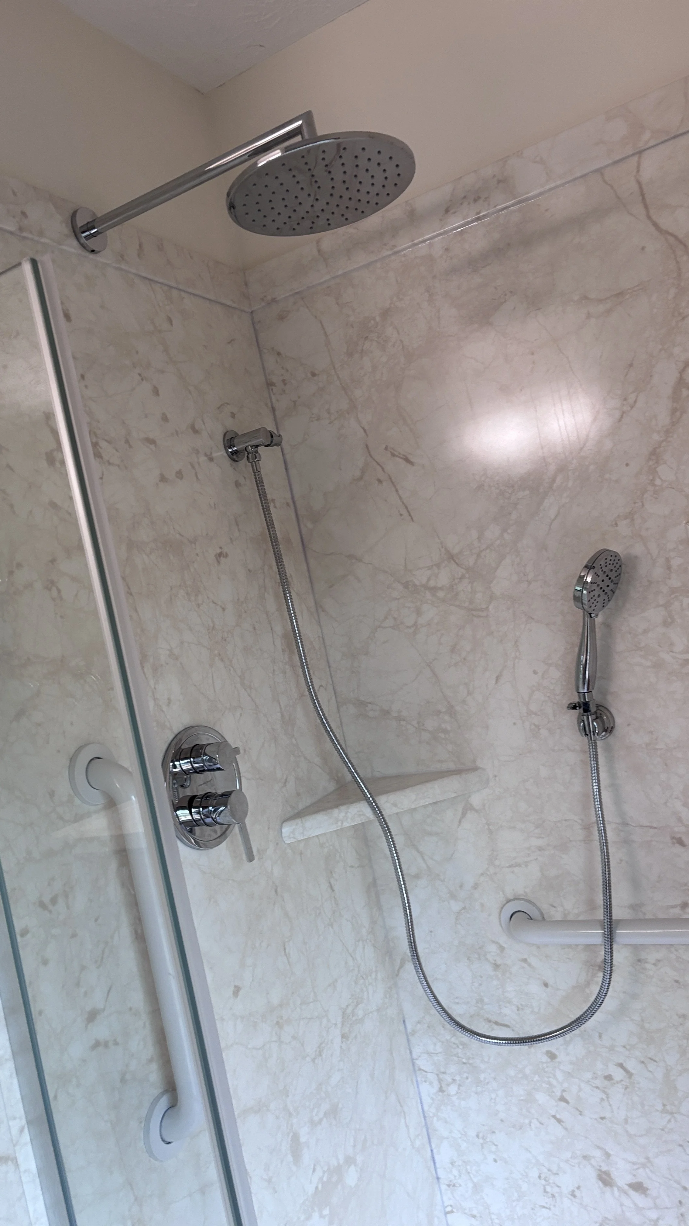 handyman bathroom remodel curbless shower swinging shower door new flooring vanity top painting wall mounted shower seat hand sprayer grab bars
