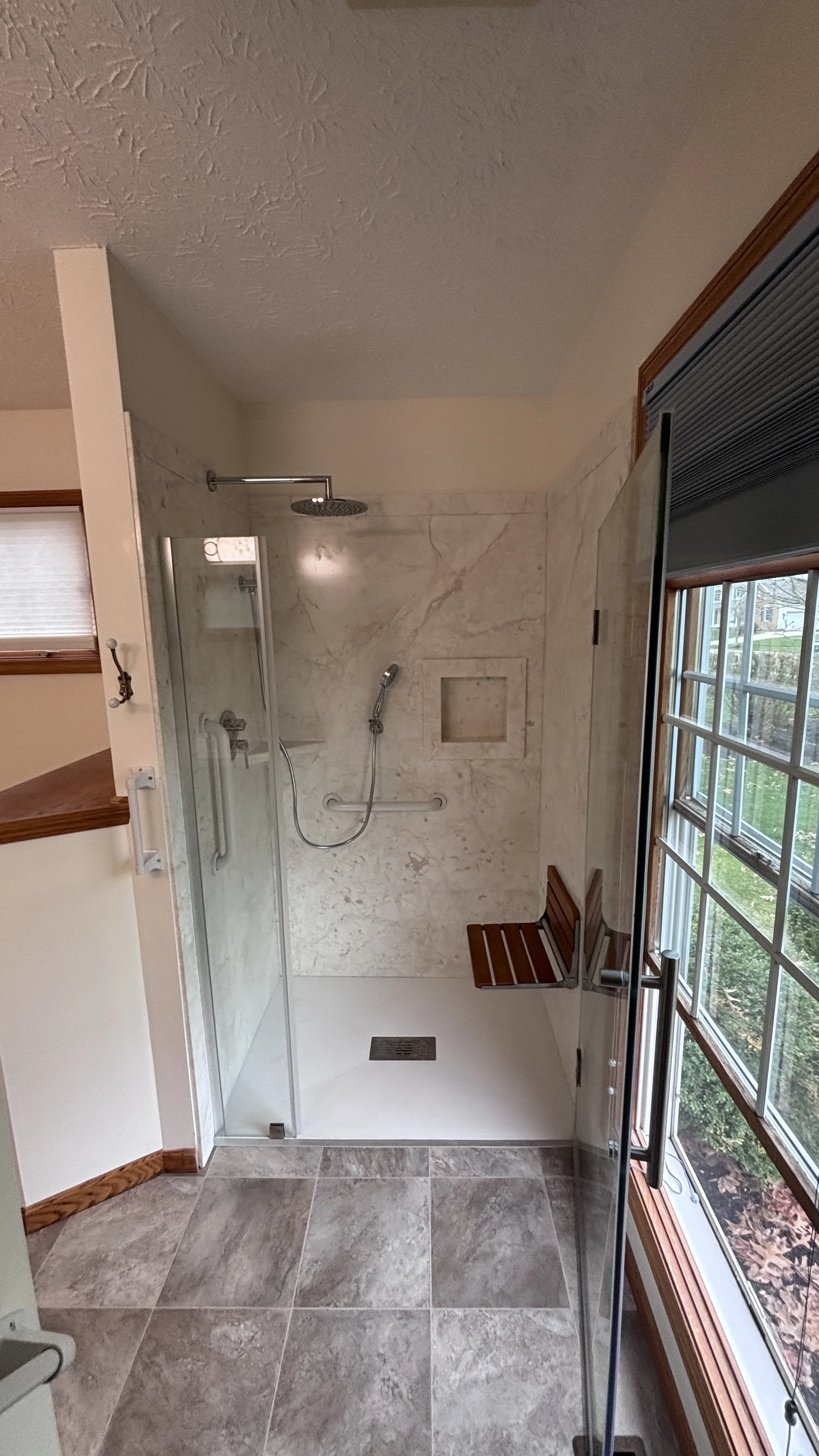 handyman bathroom remodel curbless shower swinging shower door new flooring vanity top painting wall mounted shower seat hand sprayer grab bars