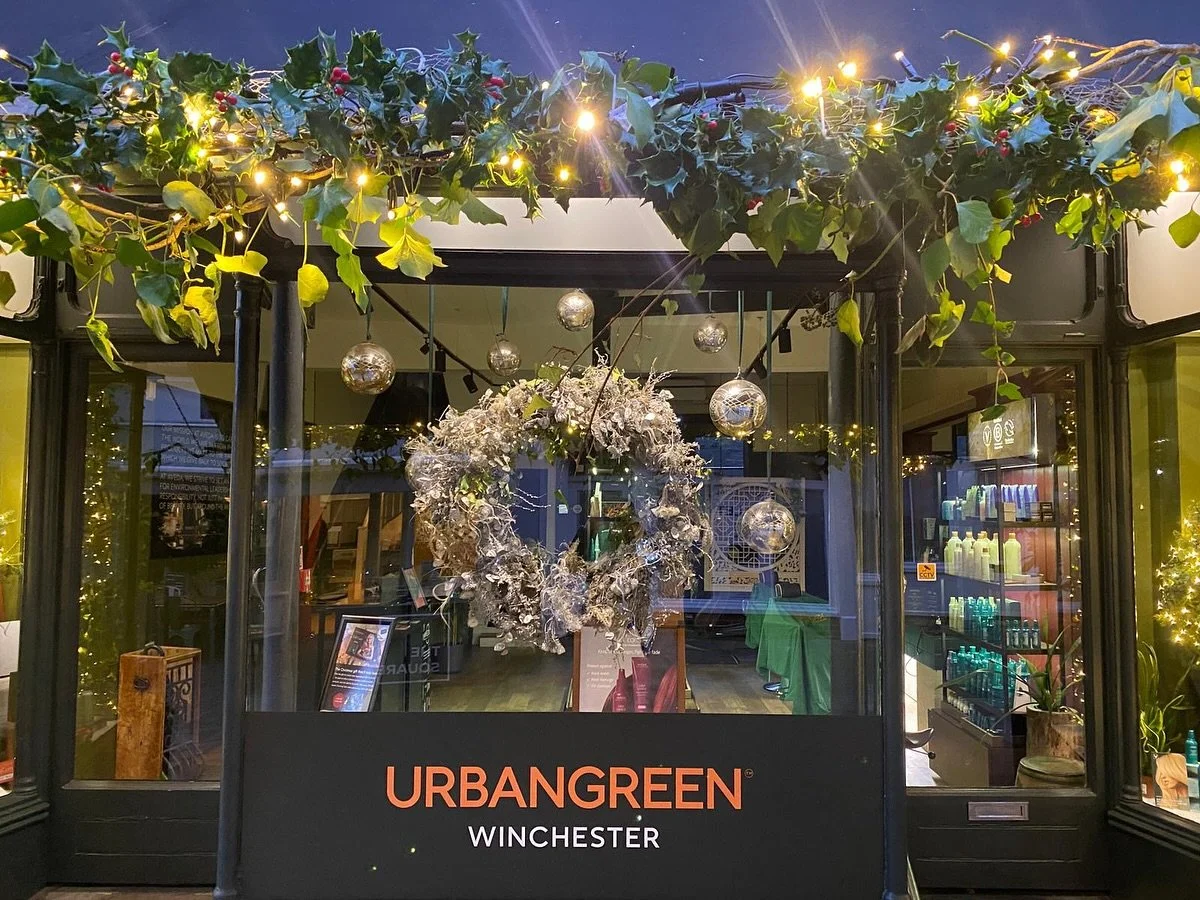 This year, our Urban Green Winchester window celebrates a wilder kind of Christmas magic &mdash; inspired by nature, created with care.
Our festive display features branches and foliage foraged locally and thoughtfully arranged to bring the outside i