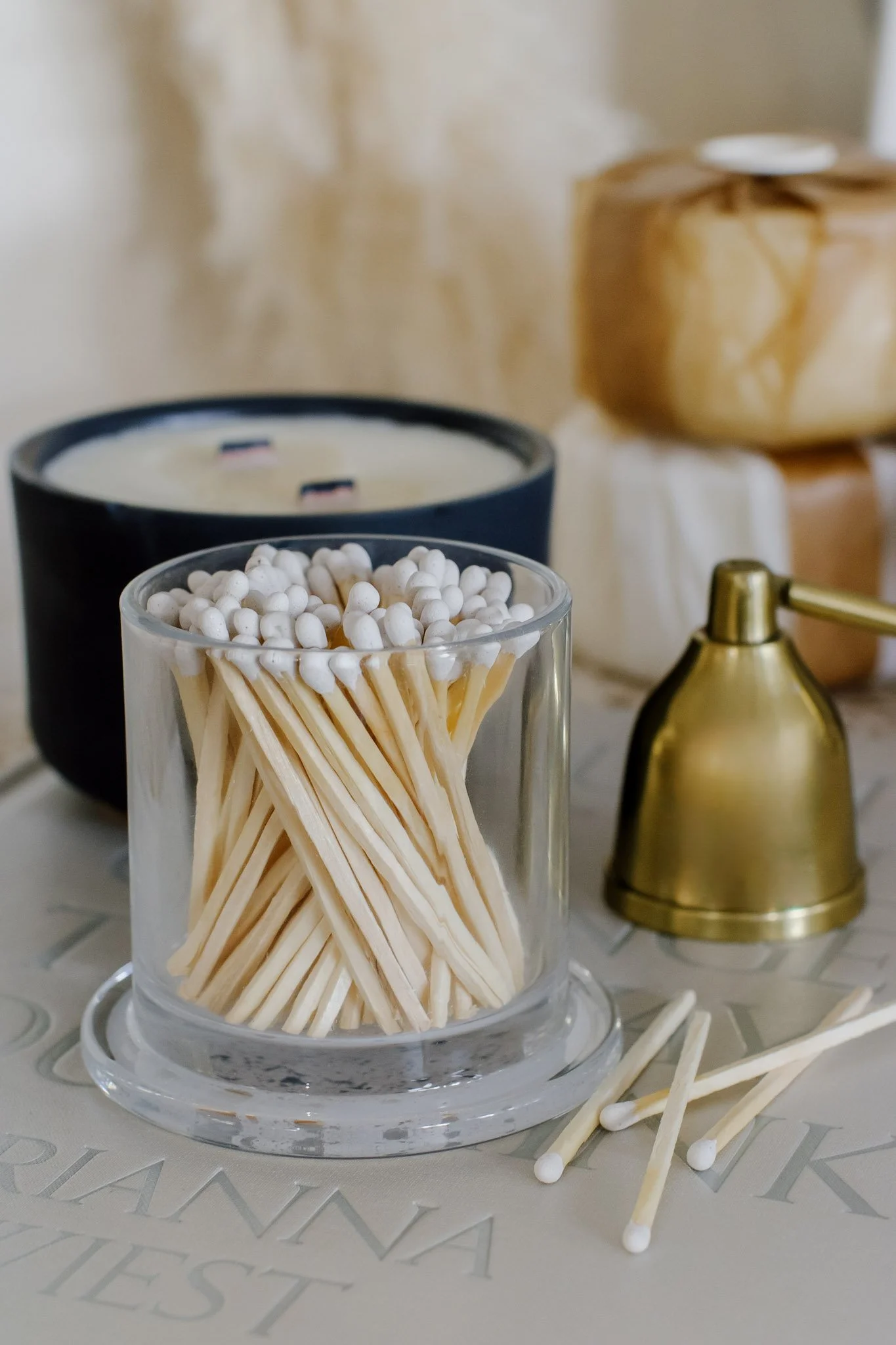Haus and Hearth Blue Candle Vessle on Book with matches.jpg