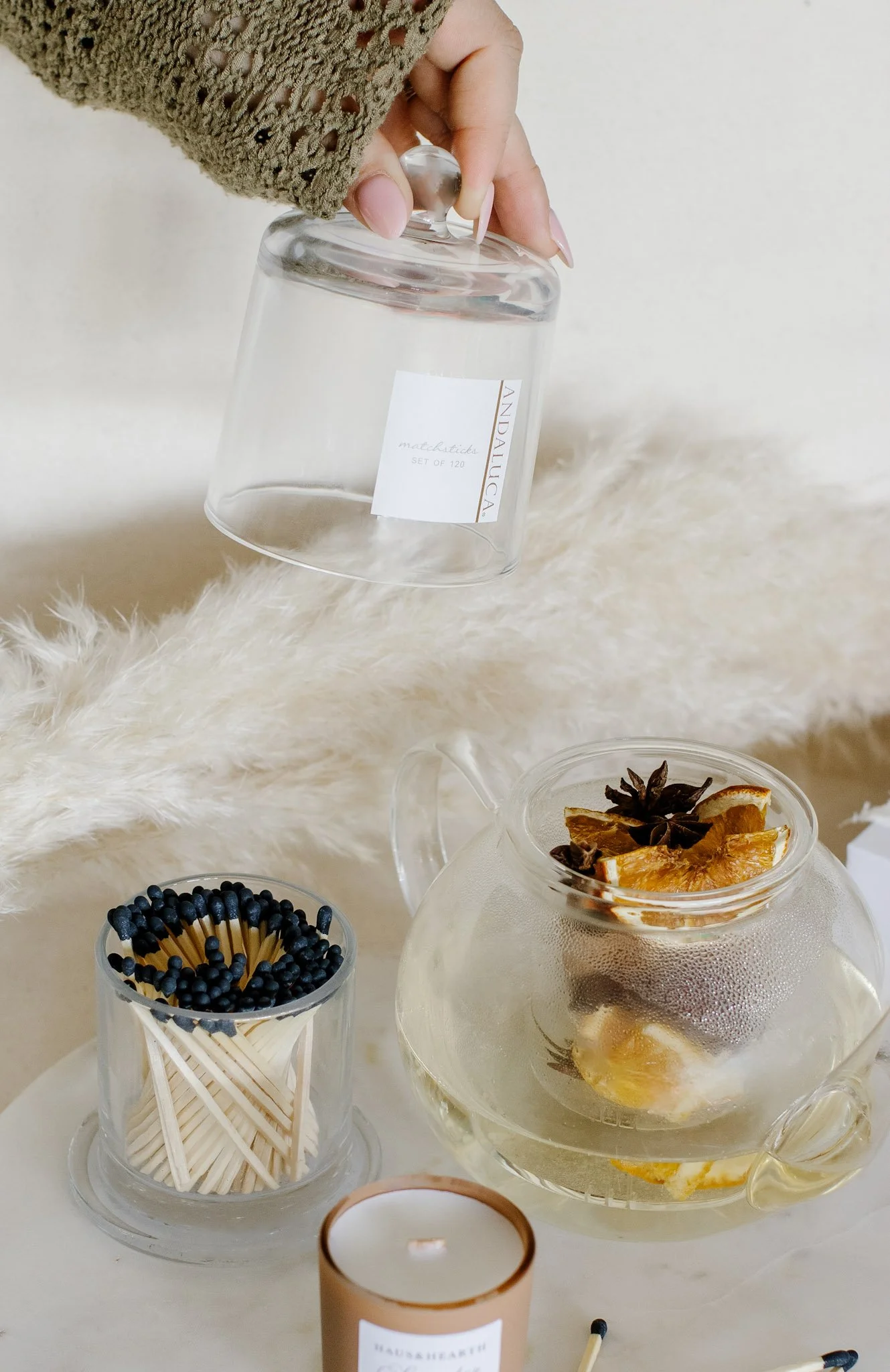 Haus and Hearth Candles, Tea and Matches With Hand.jpg