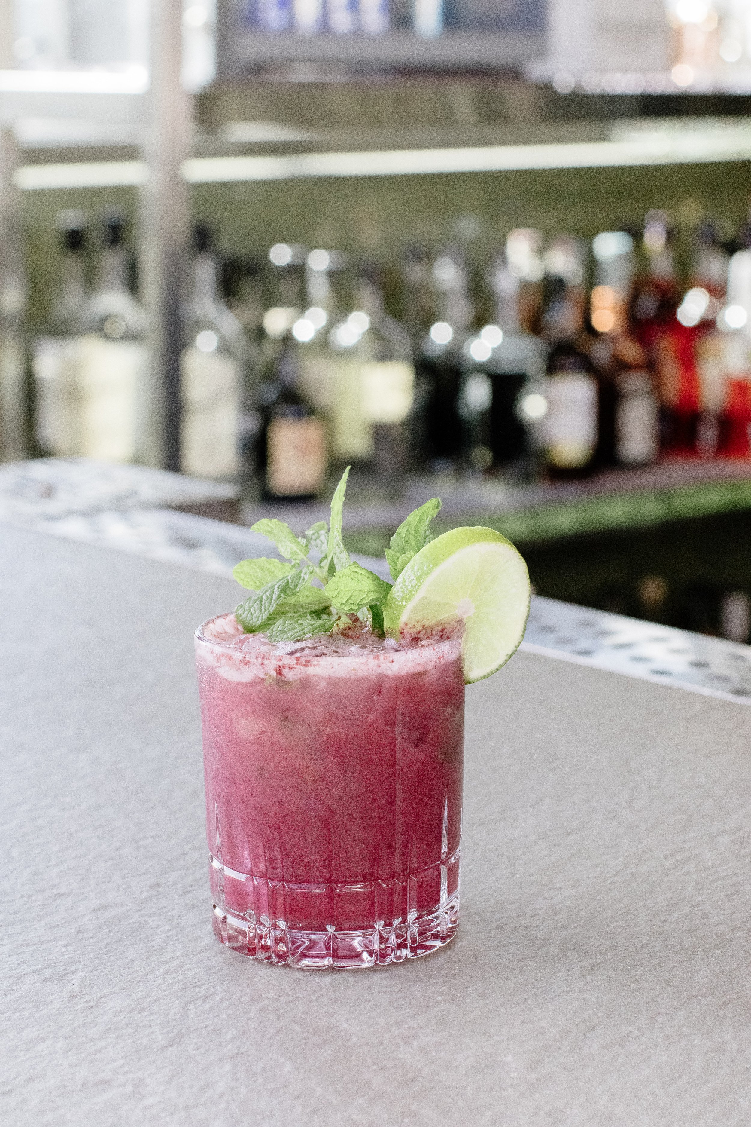We wanted to capture the collection of textures, colors, and the soft, buttery background with the supporting cast that is the fully stocked bar. Mission accomplished! Hotel SLO does it right at the High Top Bar! Photo by Catherine Coelho, styling by