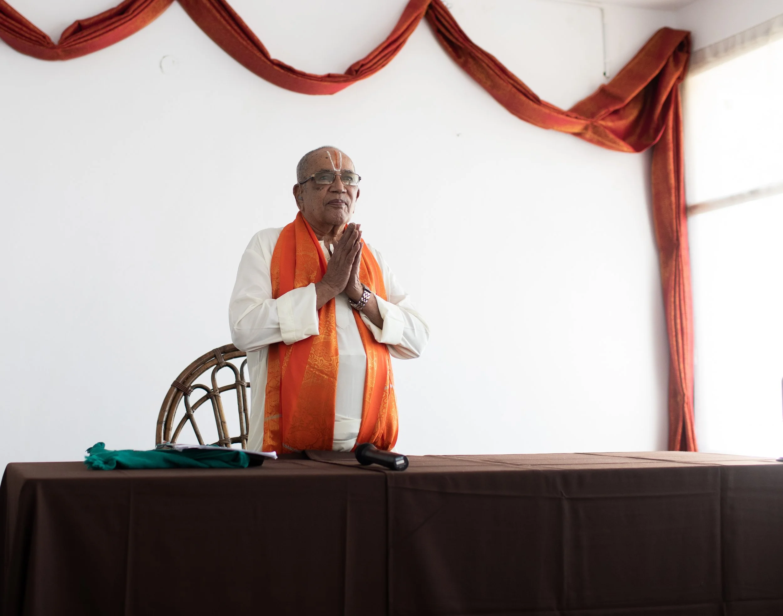 A scholar lecturing at the Mysore Yoga Conference