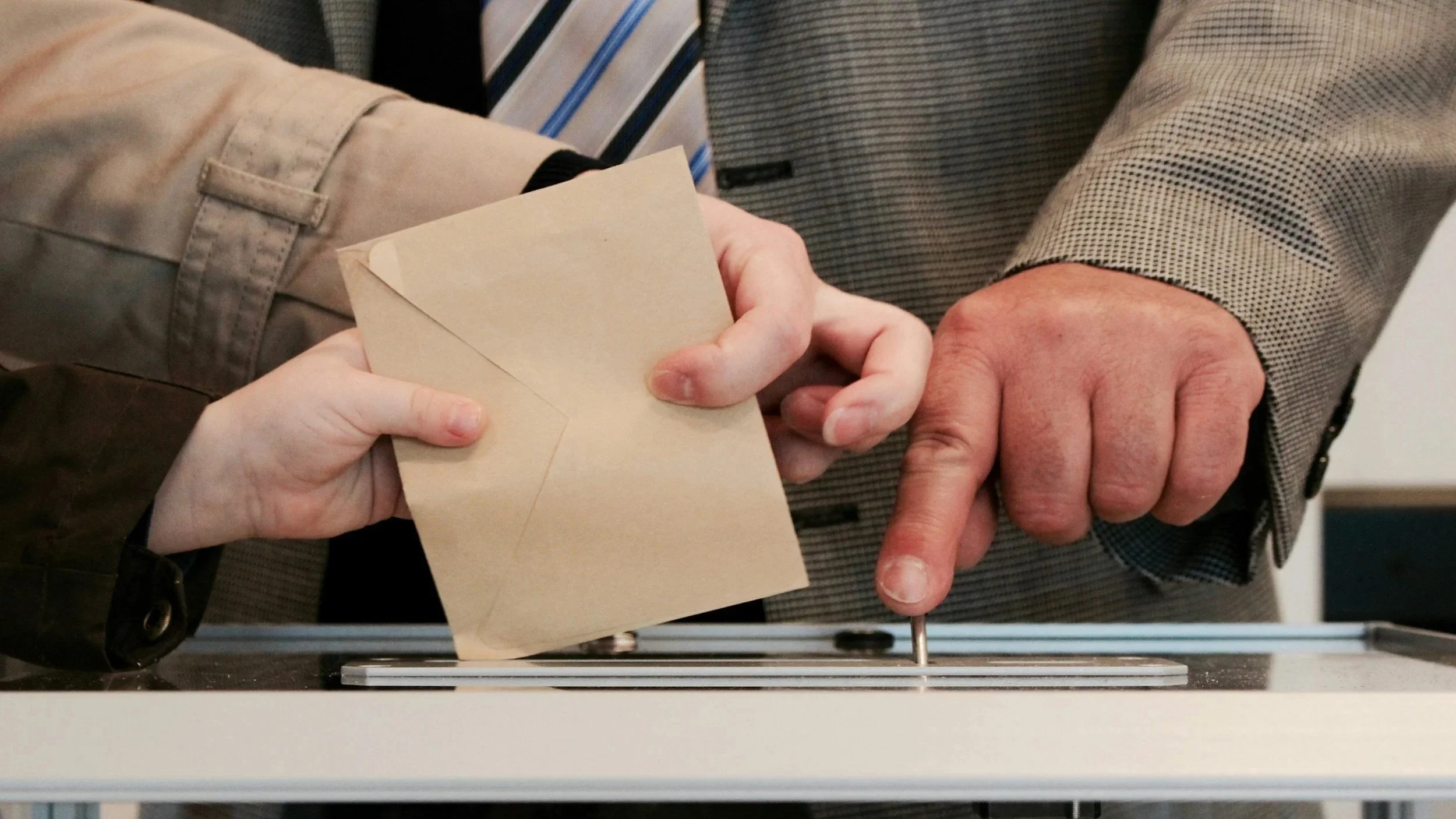hands holding ballot