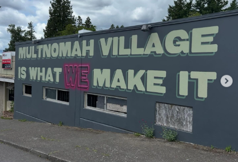 Multnomah Village is what WE make of it, painted on the side of a building.