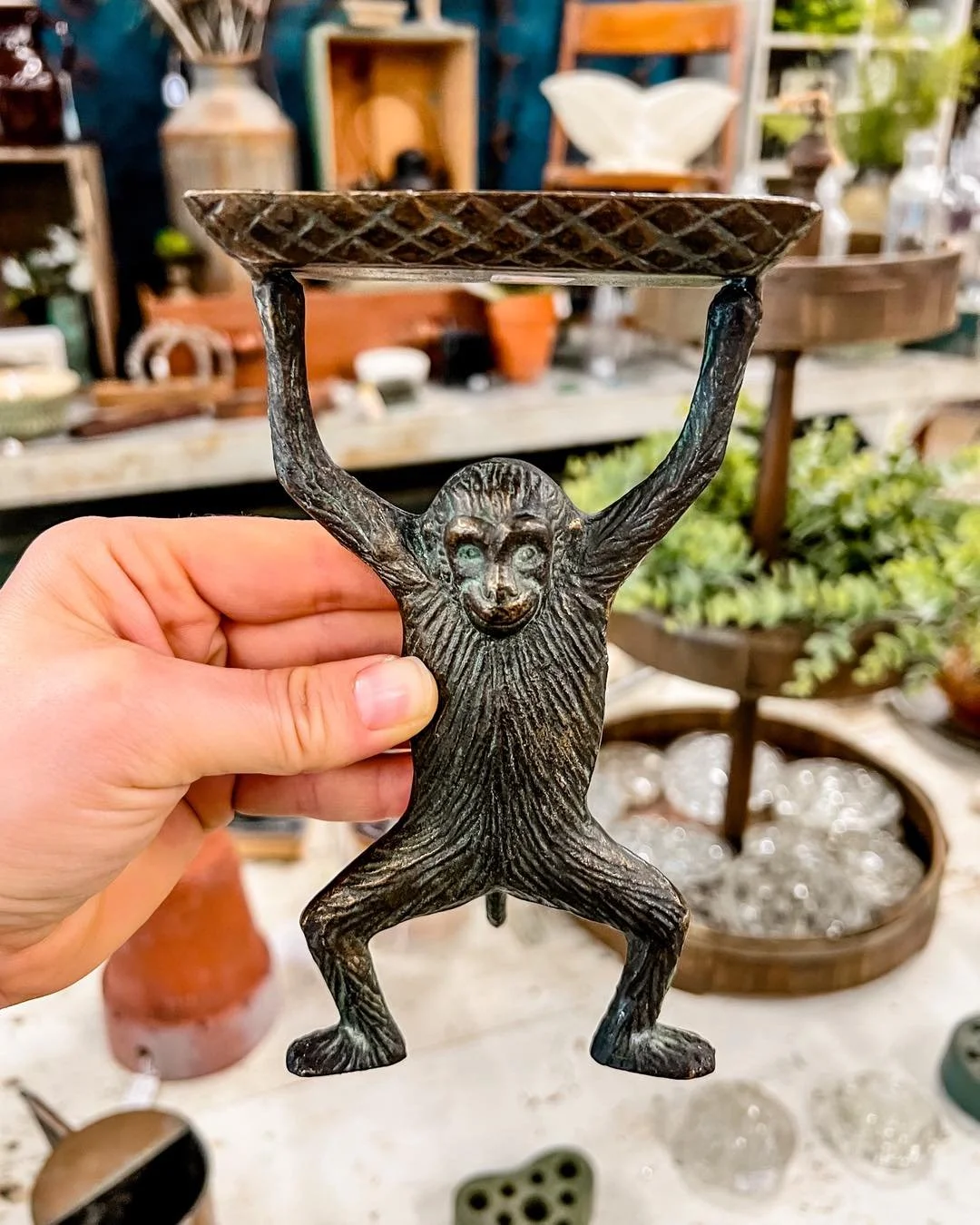 We get so many questions about our vintage monkey business card holder at the front counter. Unfortunately, that one is forever part of the shop and not for sale, but one of our vendors brought this one in and it’s ready to go home with one luc