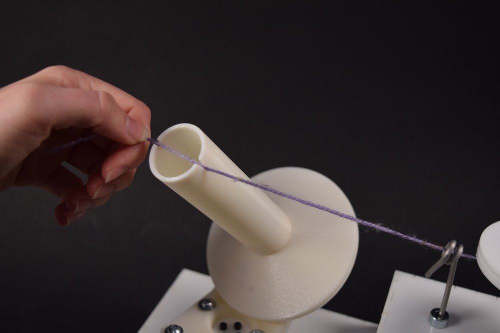 Putting String onto Ball Holder