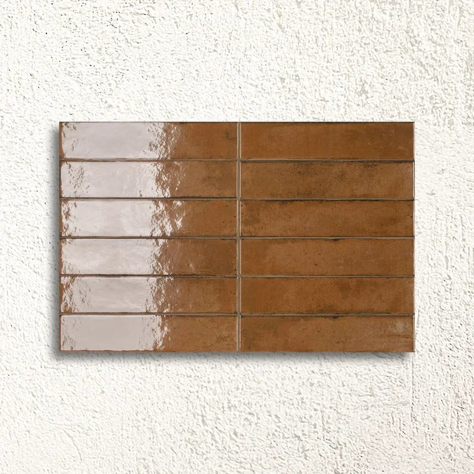 577200013_Lisbon_Terracotta-Shine_5.6x26.7cm_FACE_87b038fe-68d4-473a-8f9f-6b7edd31052e.webp