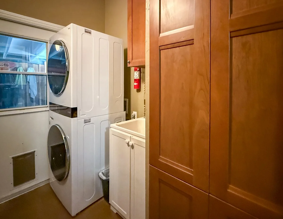 Laundry room with cabinets and sink. 