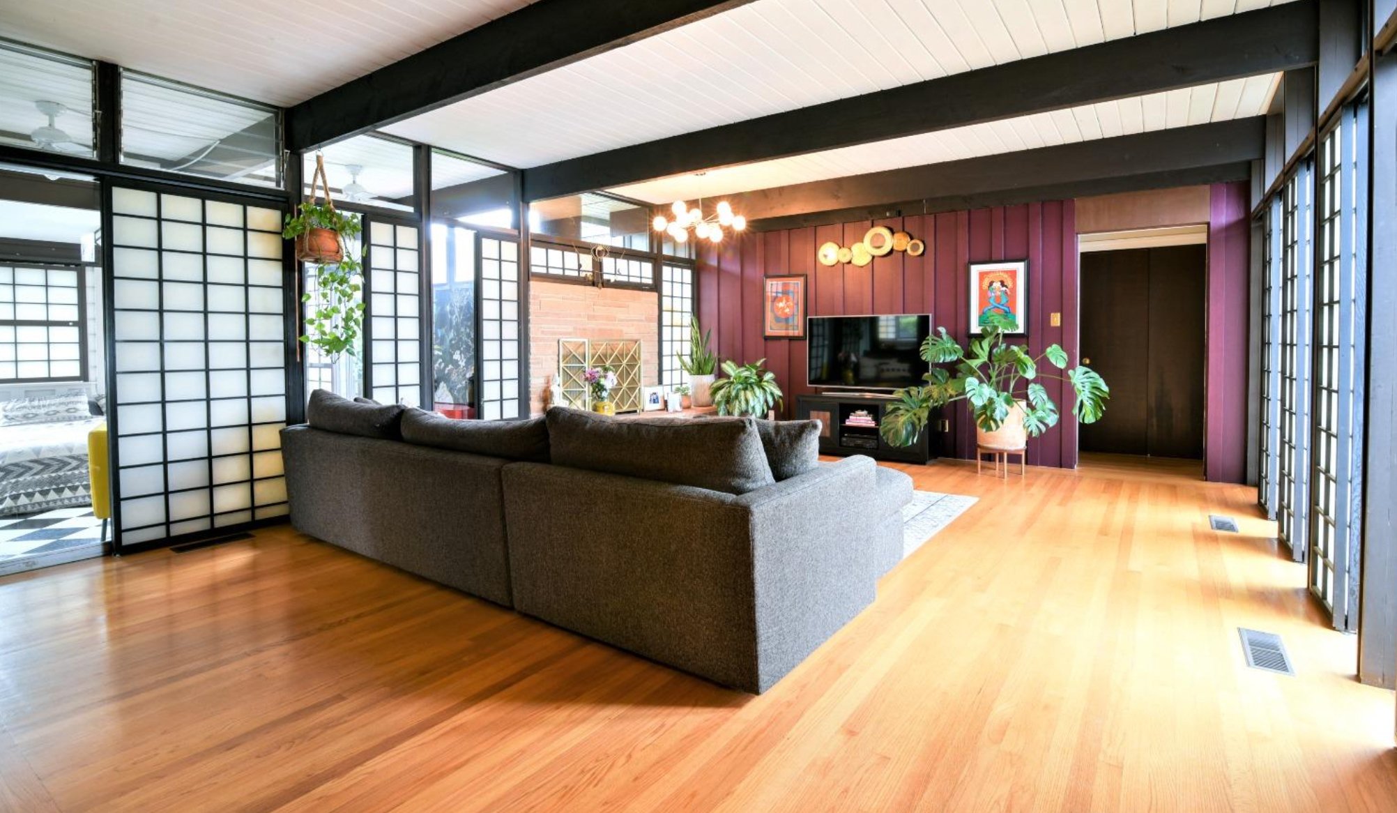 Mid Century Living Room with Shoji Screen Dividers, sofa and fireplace.