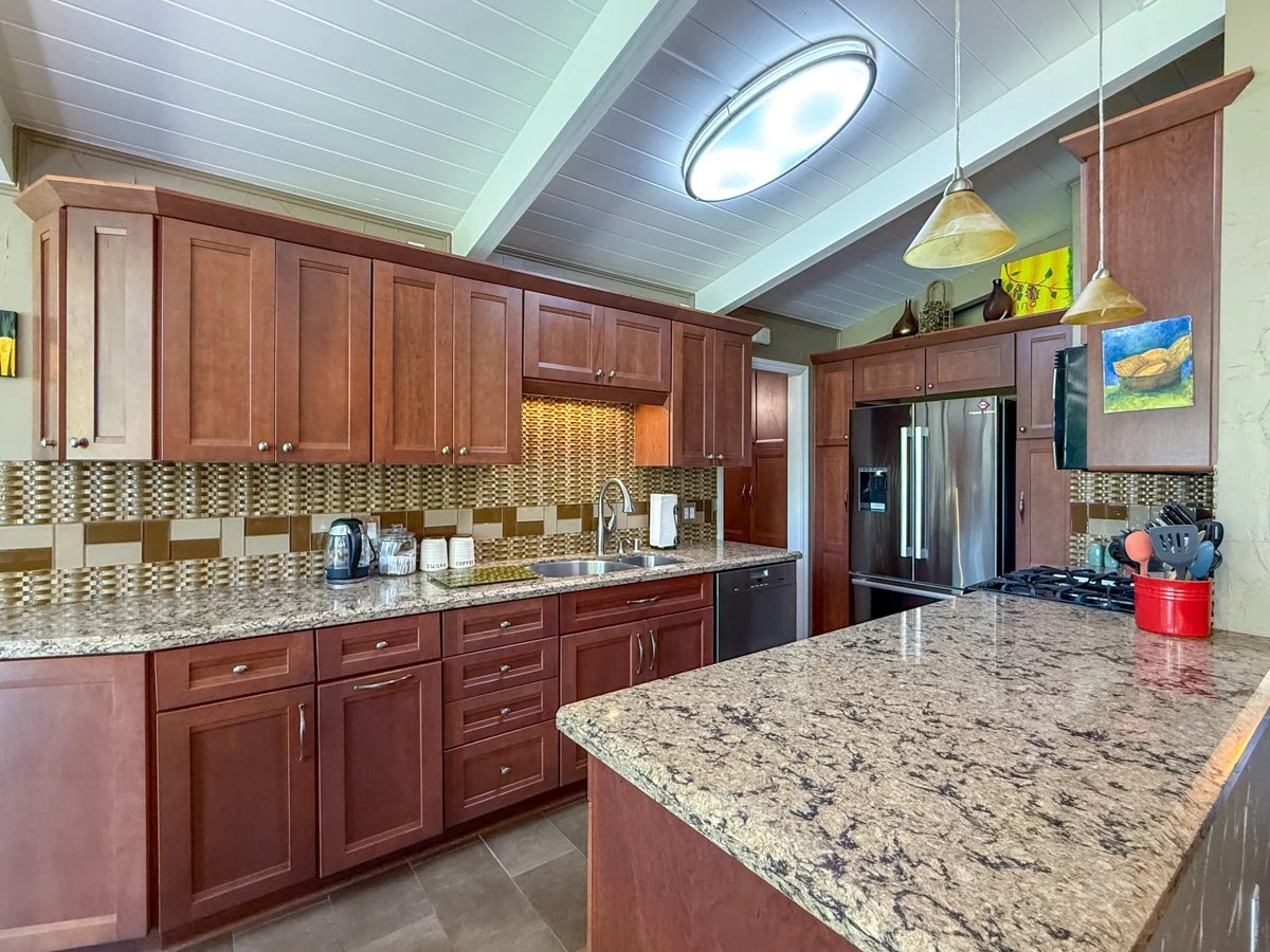 Modern kitchen with stainless steel appliances. 