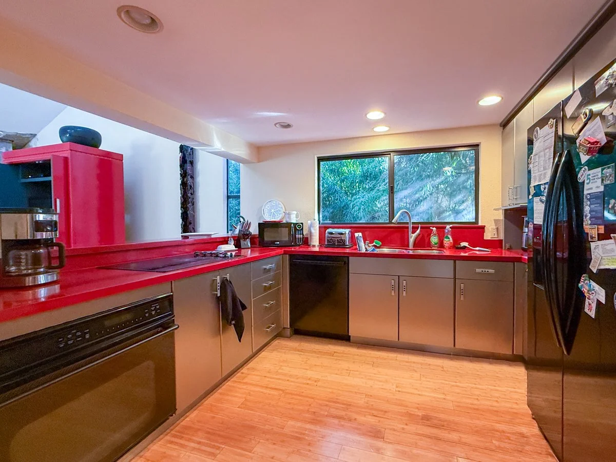 Kitchen area with quartz counters. 