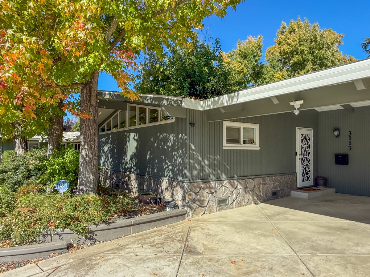 Front view with clerestory windows, new driveway. 