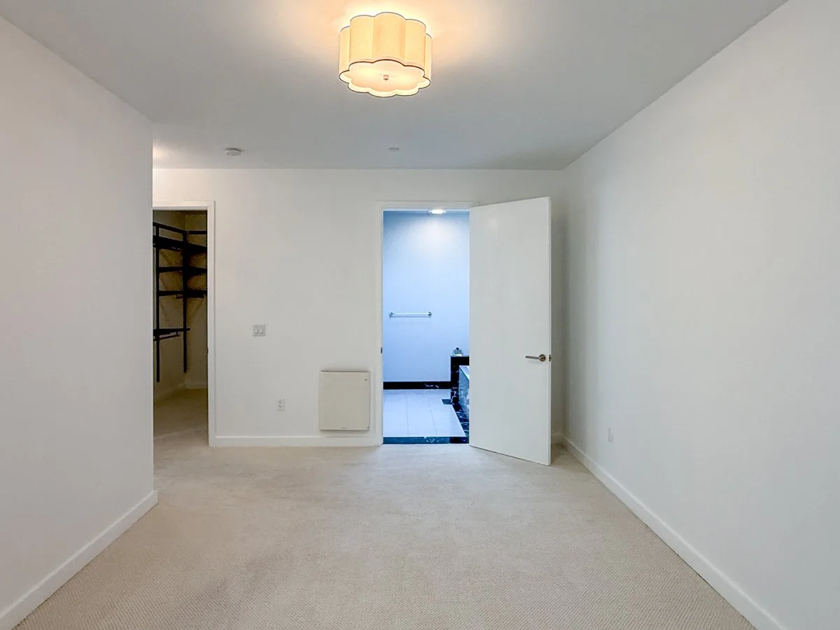 Primary Bedroom 1 with en-suite bath and walk-in closet. 