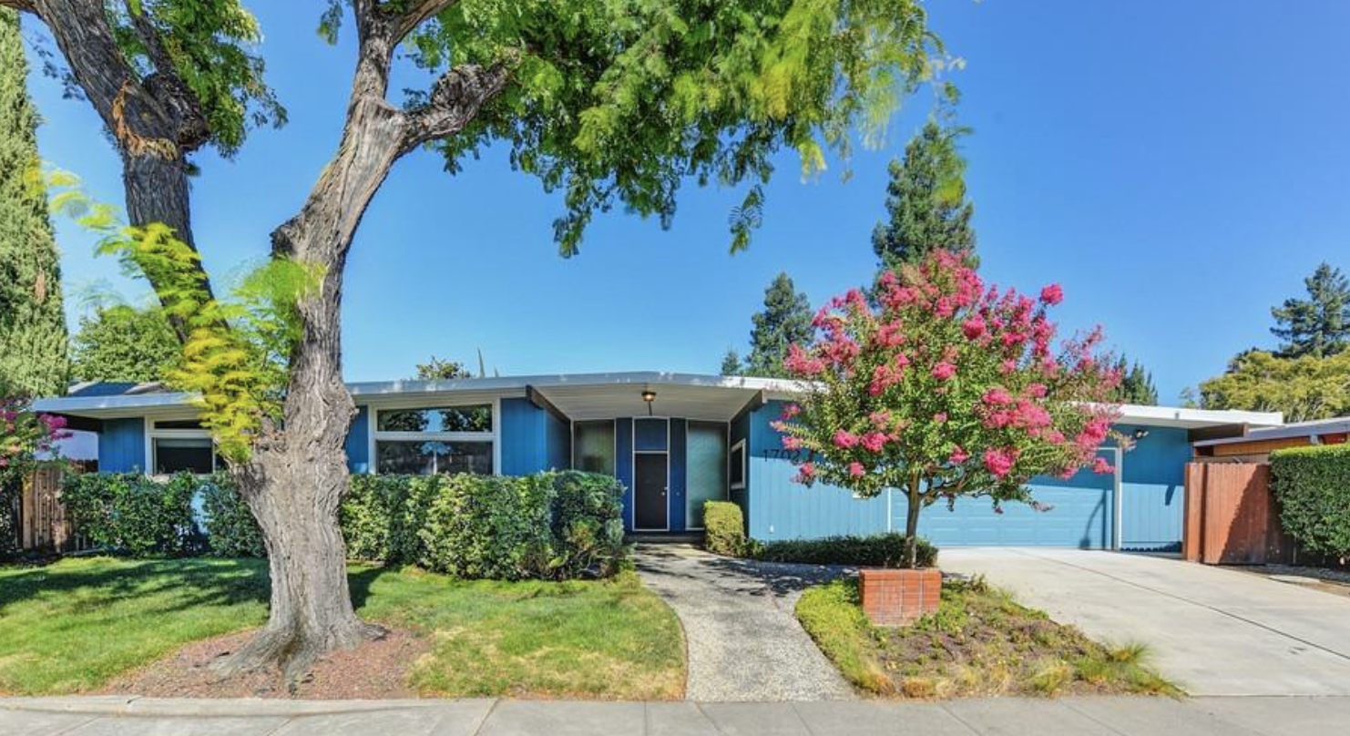 Blue painted Streng Bros mid century modern home with gable roof