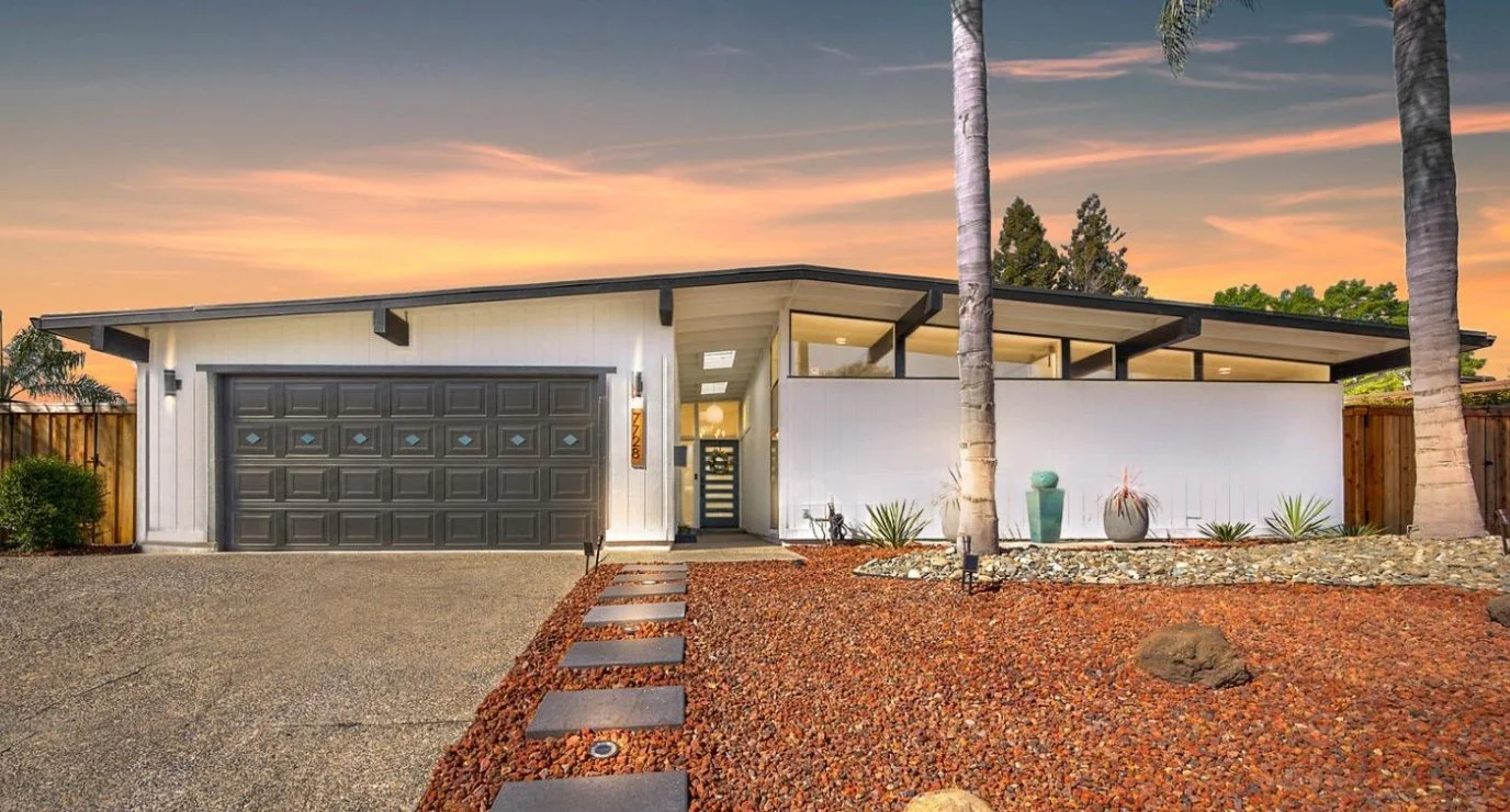 White mid century modern home with clerestory windows.