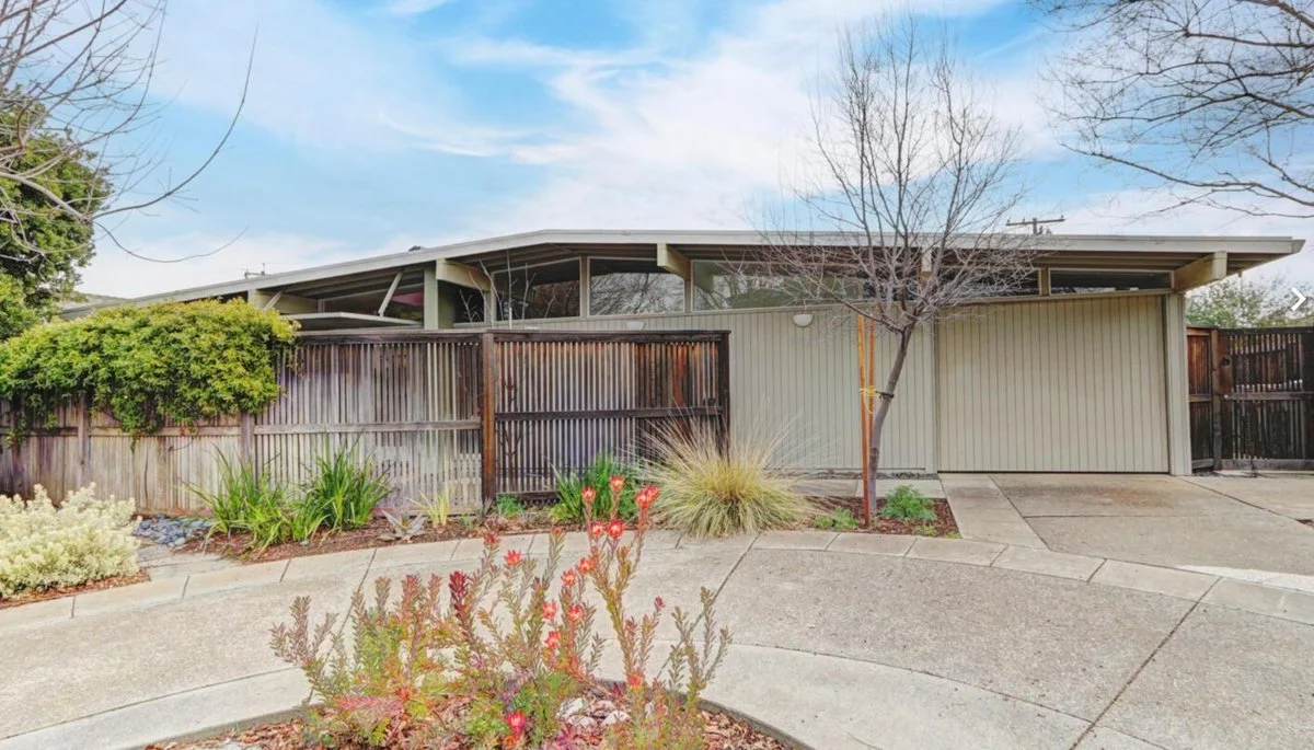 Streng Brothers home with one car garage clerestory windows.