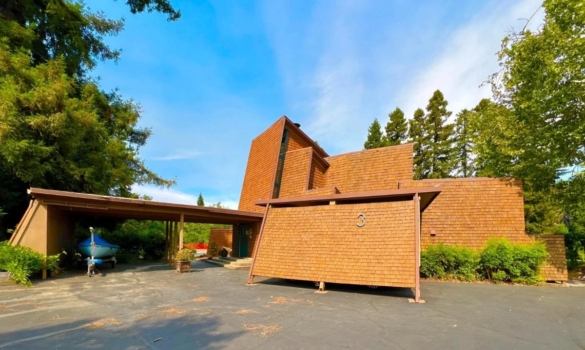 Modern house with carport and redwood shakes.