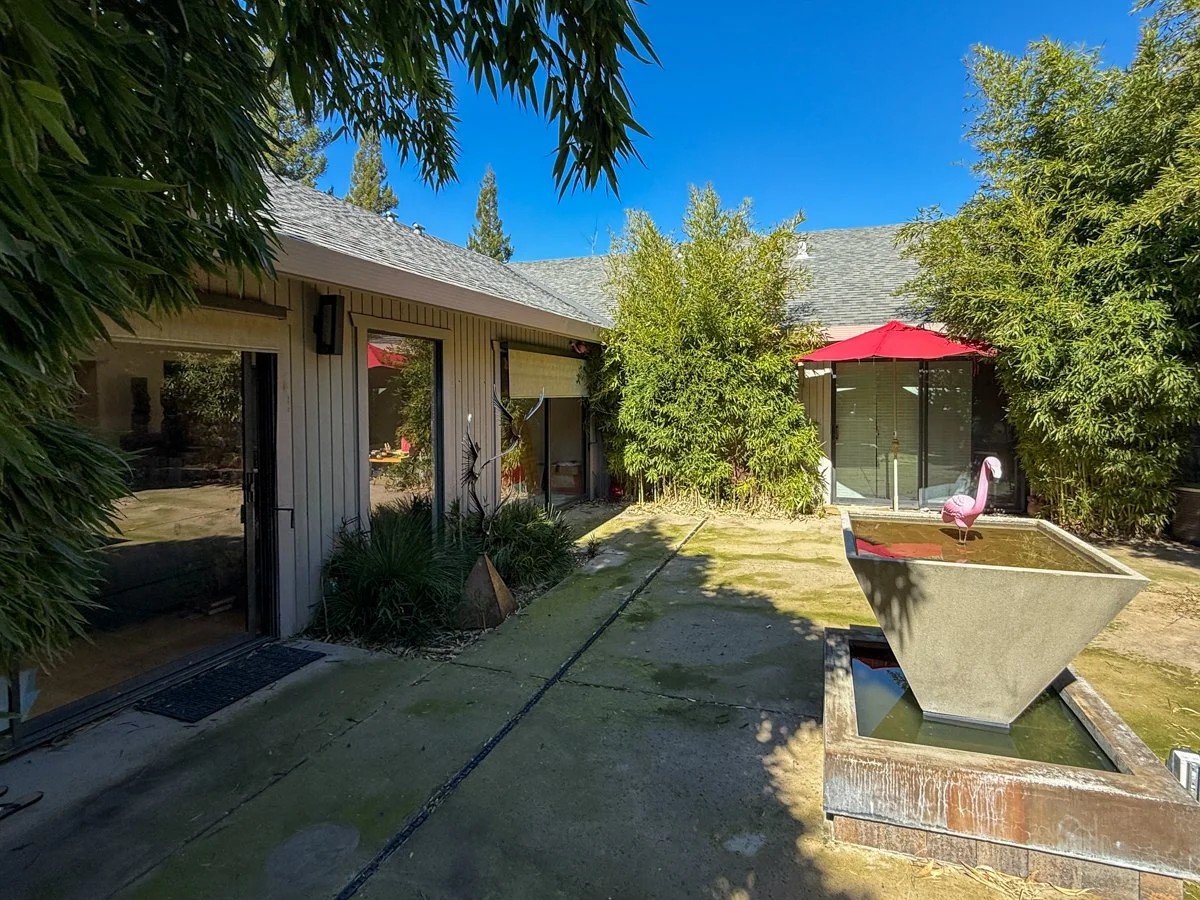 Private backyard patio with access from living room and study. 