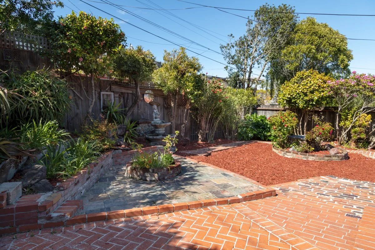 Brick patio and back yard.